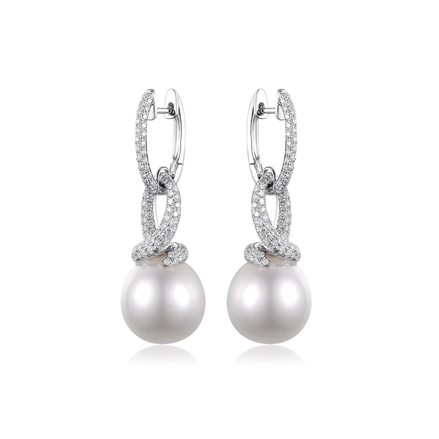 Unveiling the epitome of opulence and charm, these South Sea Pearl Diamond Dangle Earrings are designed to adorn your ears with unparalleled elegance and grace. They are a dazzling embodiment of luxury, featuring immaculate South Sea Pearls and