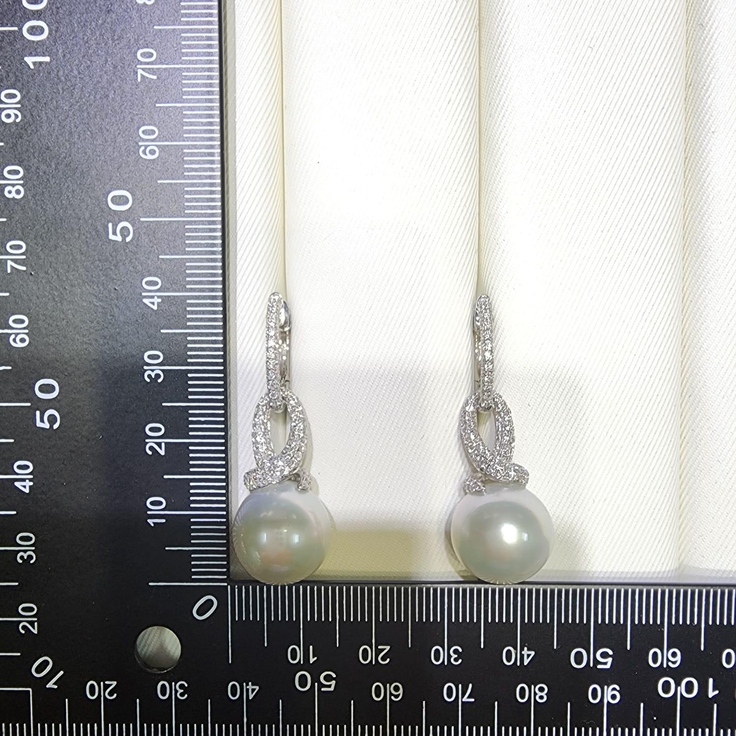 Contemporary 13.8 mm South Sea Pearl Diamond Dangle Earrings in 14 Karat Gold For Sale