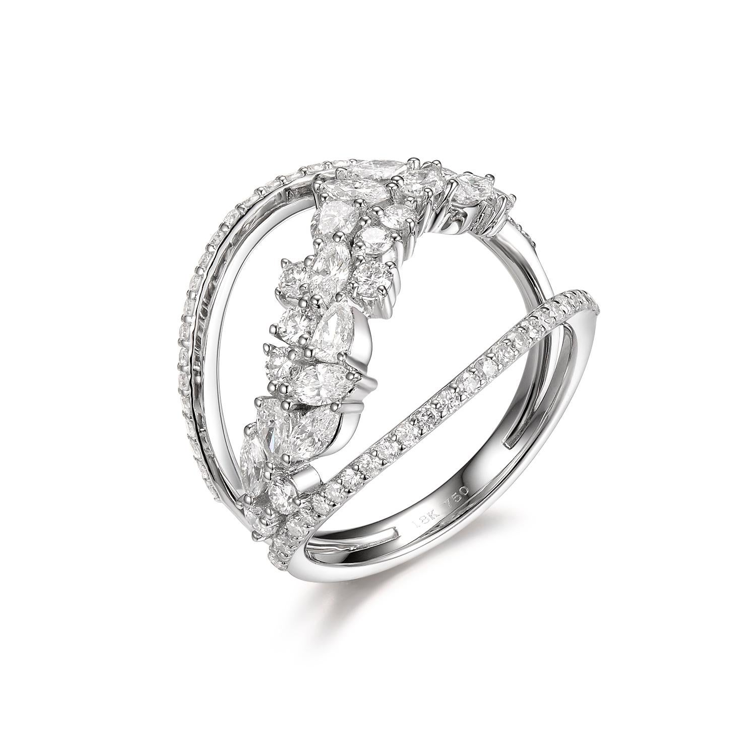 This cluster ring is hand set in 18 karat white gold. it features multiple shape diamonds. 7 marquise diamond weight 0.44 ct assented with 4 pear diamonds weight 0.27. Total carat weight is 1.38. It is stack-able with other diamond bands of your