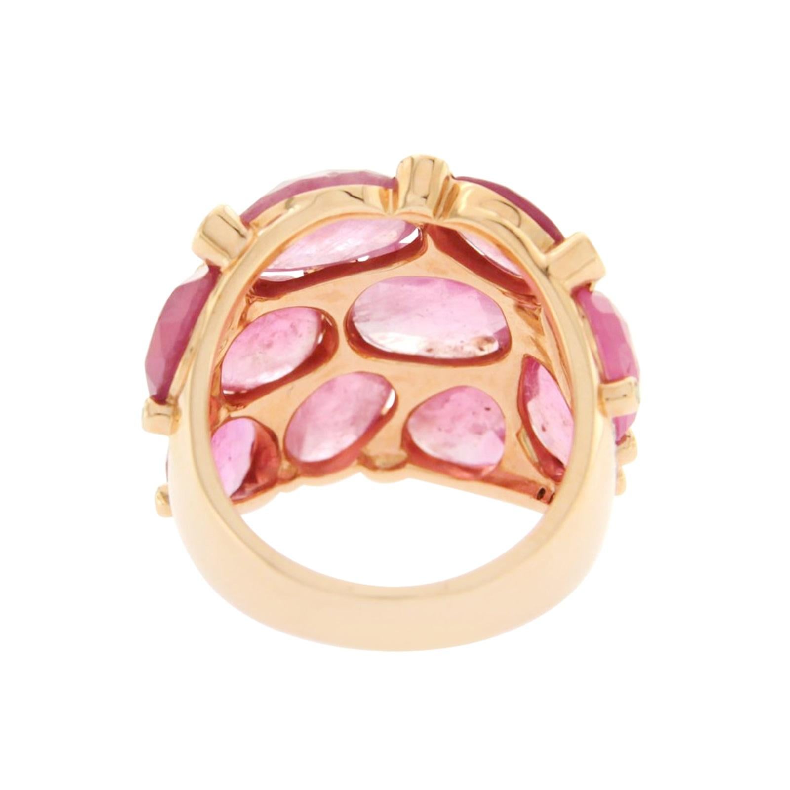 Type: Ring
Top: 22 mm
Band Width: 5 mm
Metal: Rose Gold
Metal Purity: 14K
Size:7
Hallmarks: 14K
Total Weight: 12.2 Grams
Stone Type: 0.42 Ct Diamonds VS2 G-F 13.80 CT Natural Pink Sapphire
Condition: New
Stock Number: N15