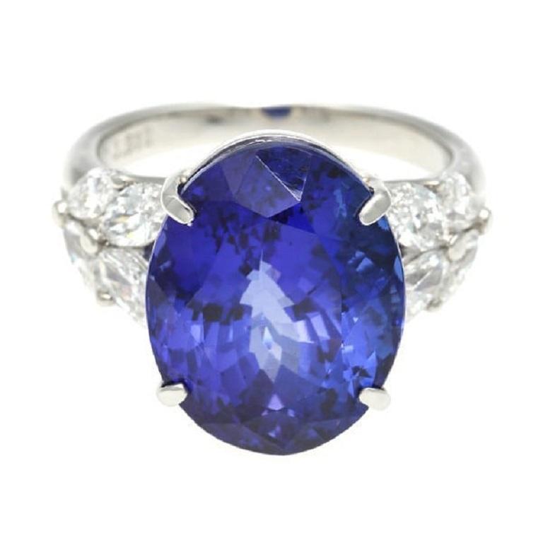 Elevate your jewelry collection with our stunning Tanzanite Ring, crafted from luxurious 900 platinum. Adorned with a mesmerizing 13.812-carat tanzanite, this ring exudes elegance and sophistication. Surrounding the vibrant tanzanite are sparkling