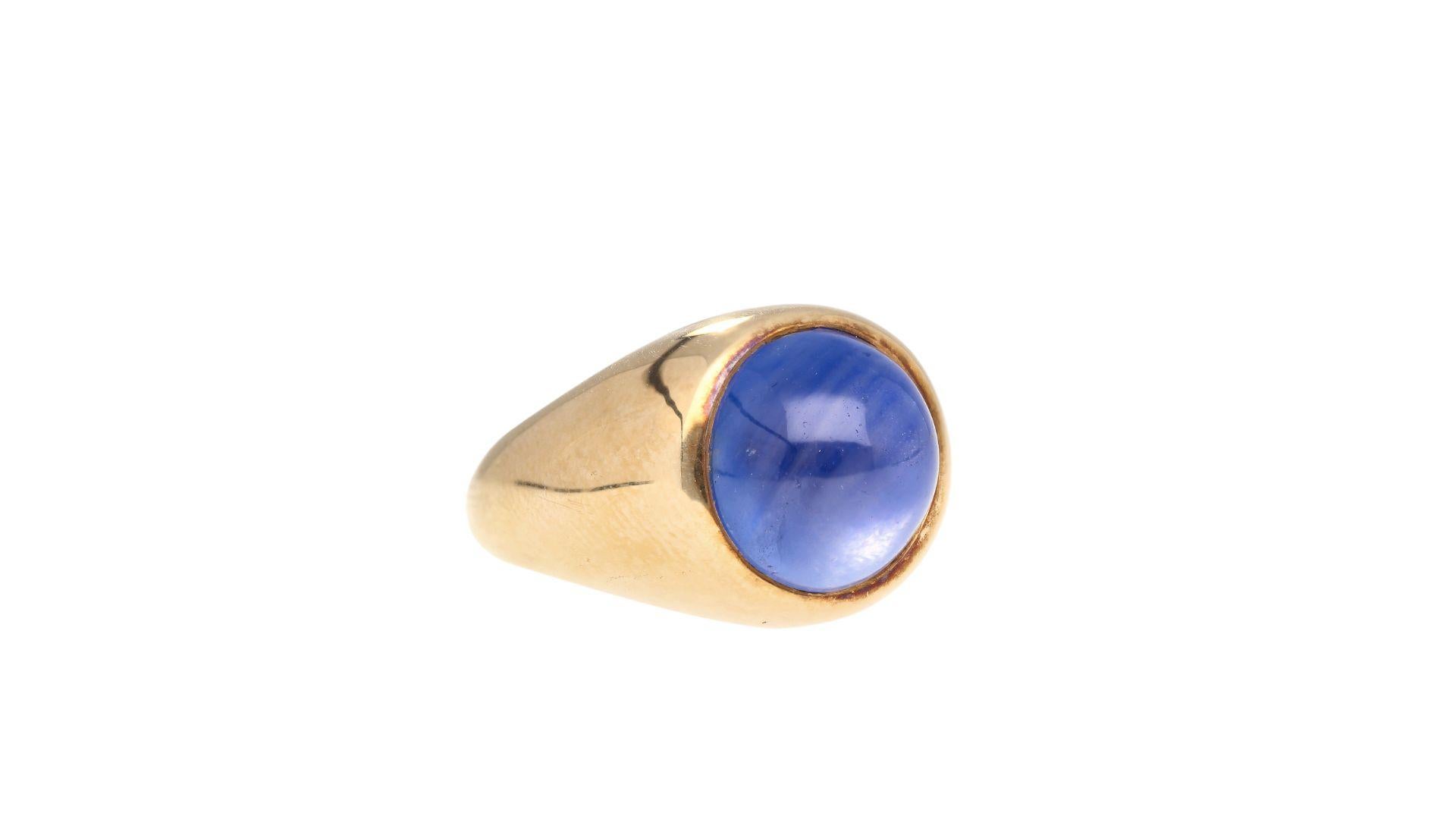 GRS Certified 13.83 carat cabochon cut no heat Blue Star Sapphire in 18k yellow gold bezel solitaire ring. The Sapphire originates from Sri Lanka and features a moderate star effect under direct light. Rich color with very good distribution.
