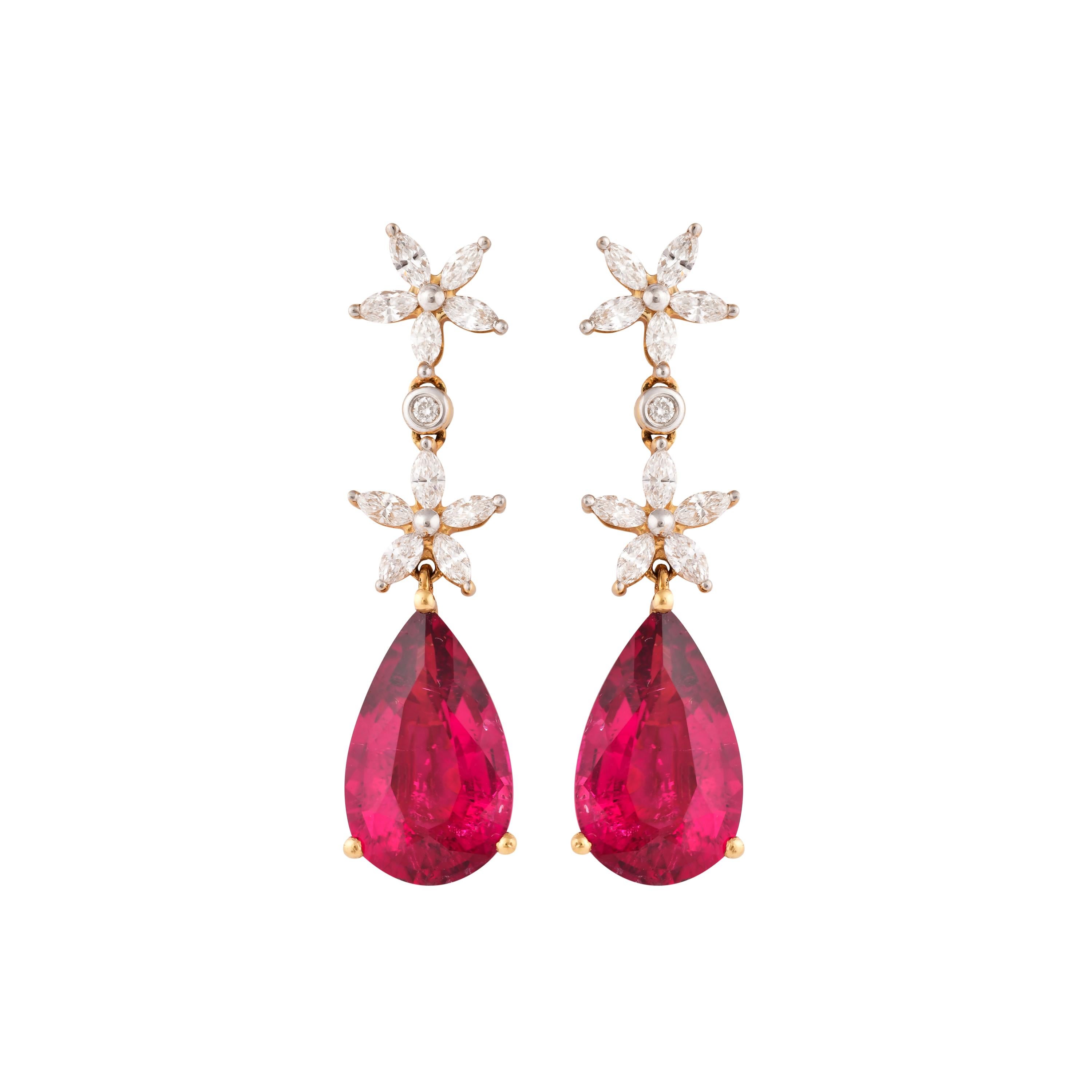 This collection features the most radiant Rubellite tourmalines. These gemstones show a magnificent and regal deep red colour, and the yellow gold and diamond accents makes these pieces a true showstopper. 

Classic Rubellite tourmaline earring in