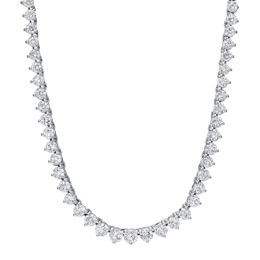 Exquisite diamond tennis chain in riviera style. Stunning diamonds are hand set in three prong mountings that are casted  in 18 karat white gold. Necklace features natural round brilliant cut diamonds weighing in 13.85 carats total ,F color, SI 1