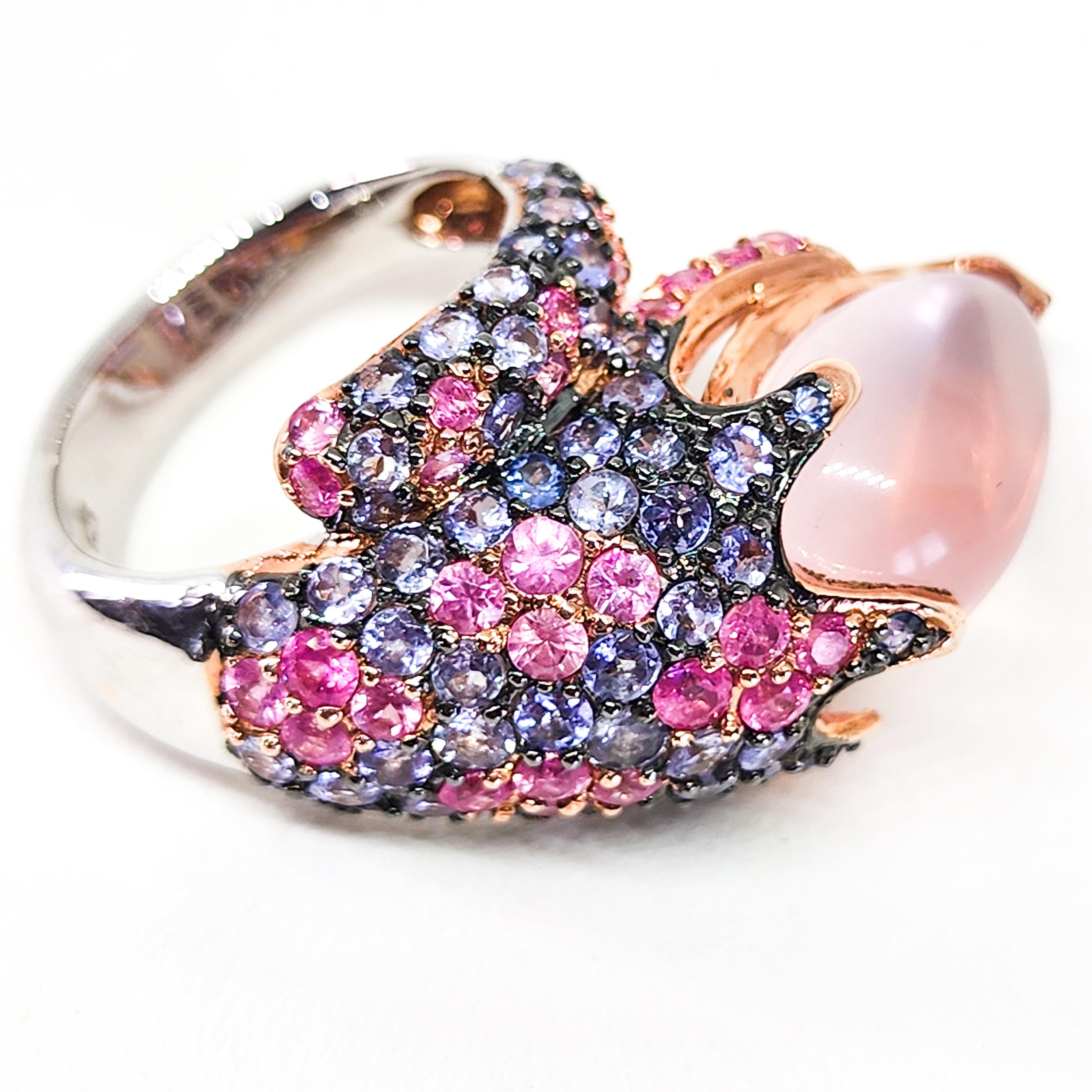 One large Domed, Bypass, Cocktail, Cluster Ring featuring a Deliciously Sweet Confectionery of Colored Gemstones in Pinks, Blues and Purples. This festive Ring is an appropriate accent for all seasons wear.  The Large face of the Ring is a wrap