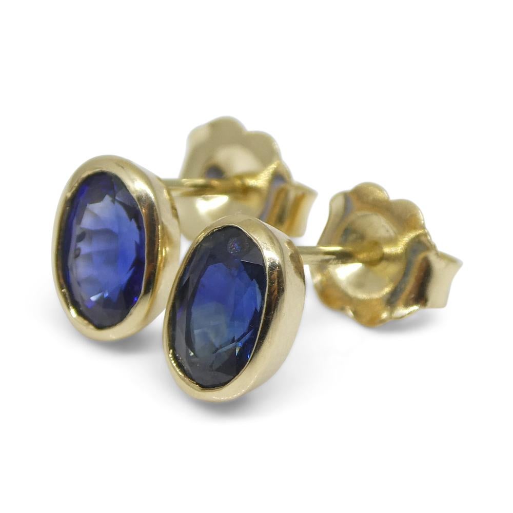 1.38ct Oval Blue Sapphire Stud Earrings set in 14k Yellow Gold For Sale 6