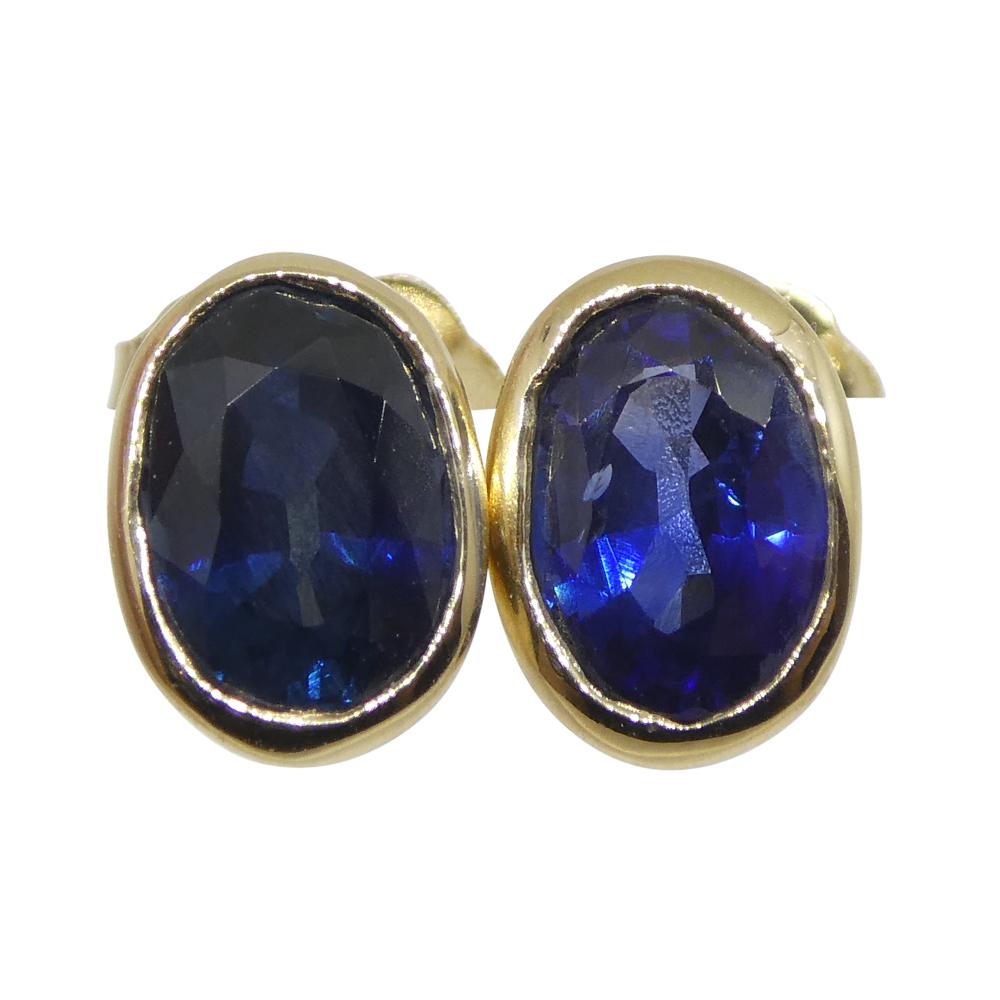 1.38ct Oval Blue Sapphire Stud Earrings set in 14k Yellow Gold In New Condition For Sale In Toronto, Ontario