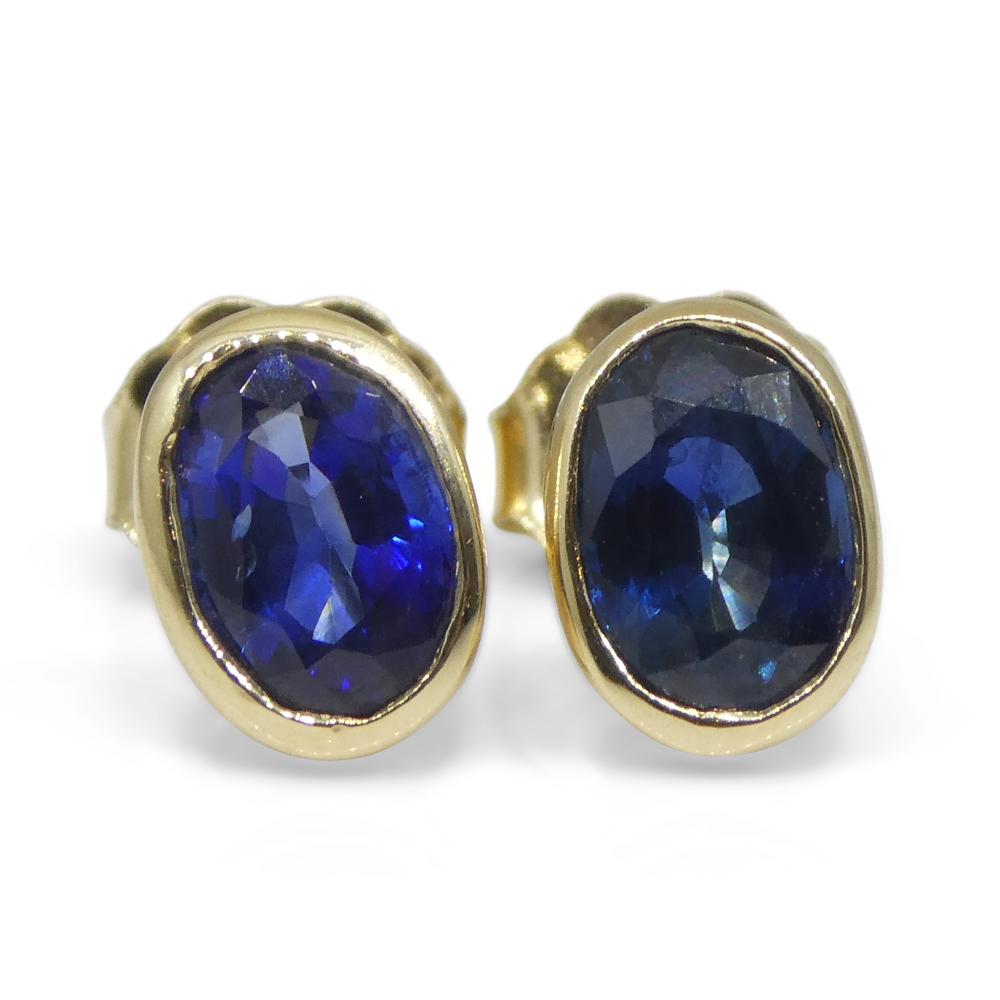 1.38ct Oval Blue Sapphire Stud Earrings set in 14k Yellow Gold For Sale 3