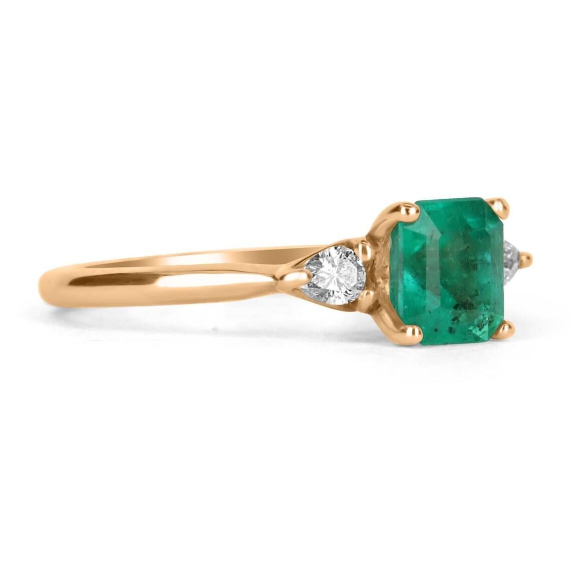A classic Colombian emerald and diamond three-stone engagement, statement, or right-hand ring. Dexterously crafted in gleaming 14K yellow gold this ring features a 1.18-carat natural Colombian emerald-emerald cut from the famous Chivor mines. Set in