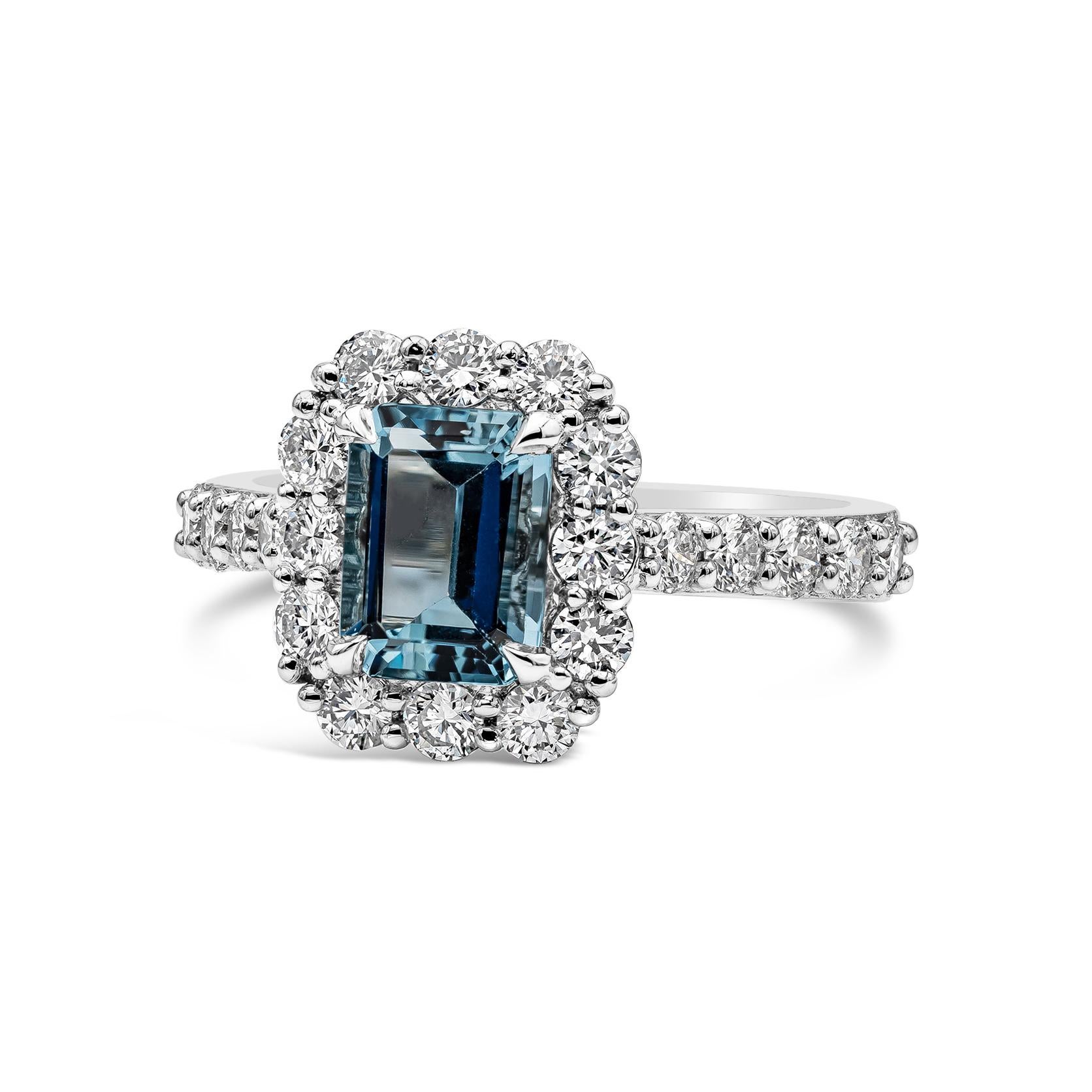 A timeless engagement ring style showcasing a 1.39 carat emerald cut aquamarine, surrounded by a row of round brilliant diamonds set in platinum. Accent diamonds weigh 1.12 carats total and are approximately F color, VS clarity.

Style available in