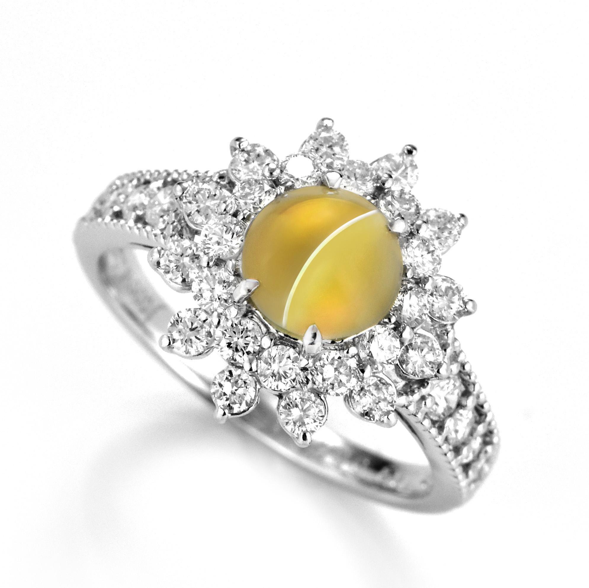 A stunning Ring featuring a 1.39 Carat Natural Cat's Eye Chrysoberyl and 0.78 Carats Diamond Accents set in Platinum. Cat's Eye Chrysoberyl exhibit a unique, naturally occurring phenomena called Chatoyancy or 