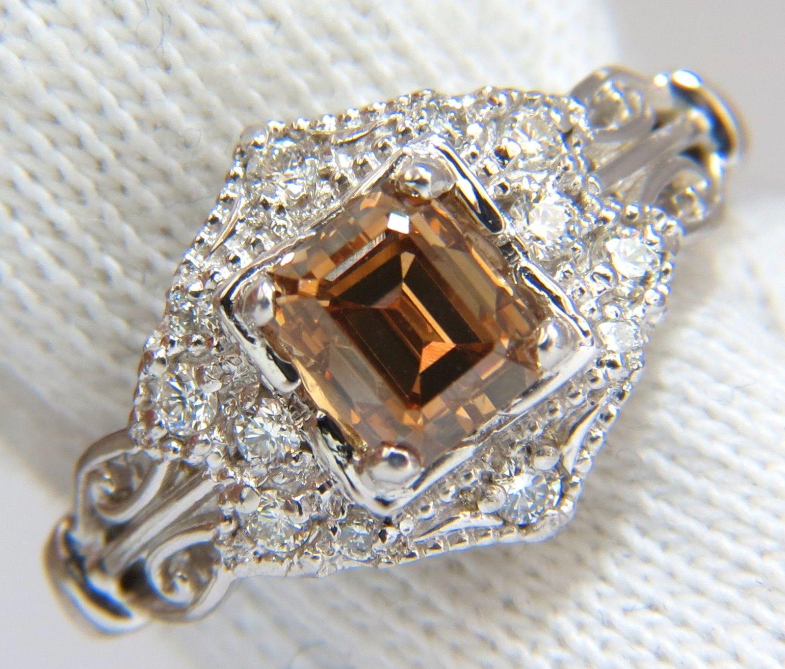 Victorian Era Fancy Natural Brown diamond ring.

1.18ct. Natural Brown Diamond

Emerald cut

Vs-2 - clarity



Side round diamonds:

.21ct. 

G-color Vs-2 clarity

  14kt. white gold

4 grams

Ring Current size: 6.5

(Free Resize Service, Please