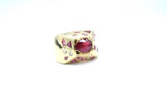 1.39 Carat Oval Ruby Pyramid Shaped Mixed Diamonds Rubies 18 Karat Gold Ring