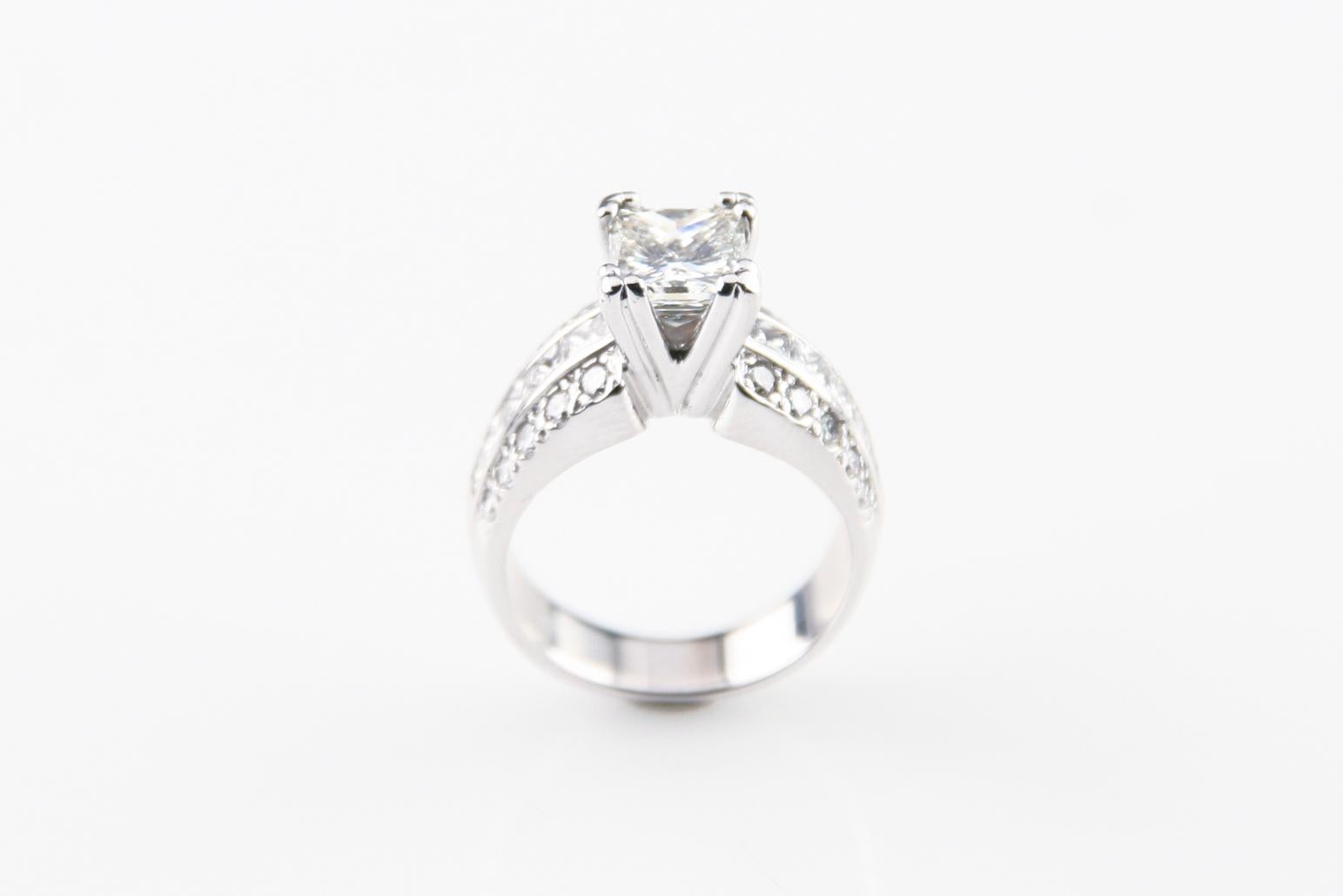 Gorgeous 14k White Gold Engagement Ring
Solitare Princess Cut Engagement Ring w/ Accent Diamonds
Ring Size = 4.5
Total Mass = 8.5 grams
TDW of Accents = Approximately 1.00 ct
Accent Stones Form 3 Rows on Either Side of the Ring
Each Row has 5