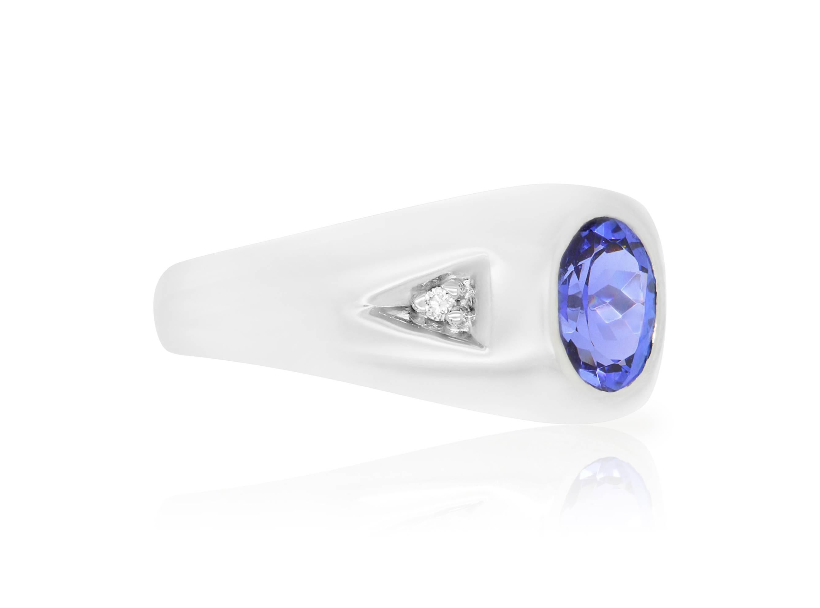 This 14k White Gold setting is a perfect fit for our 1.39 Carat Tanzanite. Surrounded on either side with a white diamonds, this classy piece is a must have men's ring.    

Material: 14k White Gold
Gemstones: 1 Oval Tanzanite at 1.39 Carats - 8 x 6