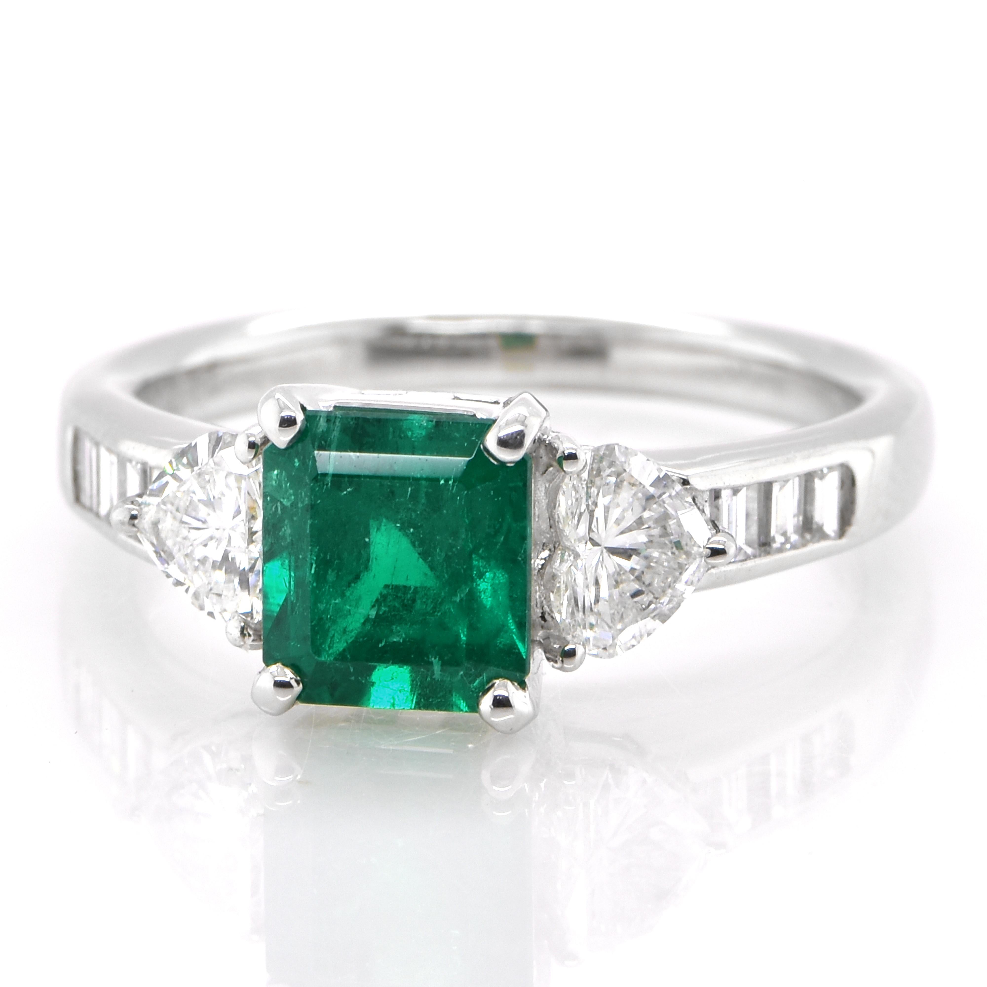 A stunning ring featuring a 1.39 Carat Natural Emerald and 0.70 Carats of Diamond Accents set in Platinum. People have admired emerald’s green for thousands of years. Emeralds have always been associated with the lushest landscapes and the richest