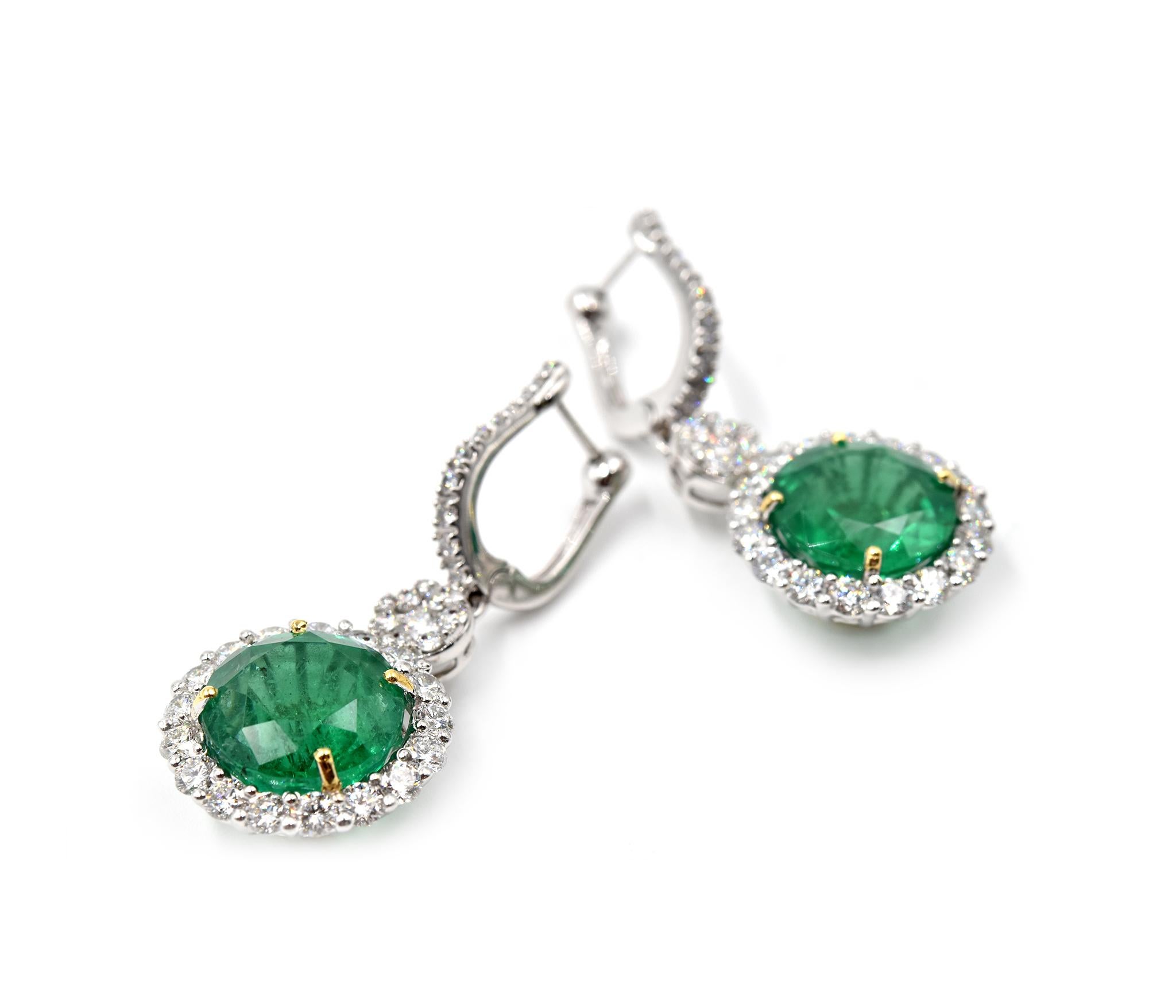 Designer: custom design
Material: 18k white gold
Emeralds: 13.92 carats round brilliant cut = two emeralds
Diamonds: 82 round brilliant cut = 3.38 carat total weight
Color: G
Clarity: VS 
Dimensions: each drop earring is 1 1/2-inch long and 1/2-inch