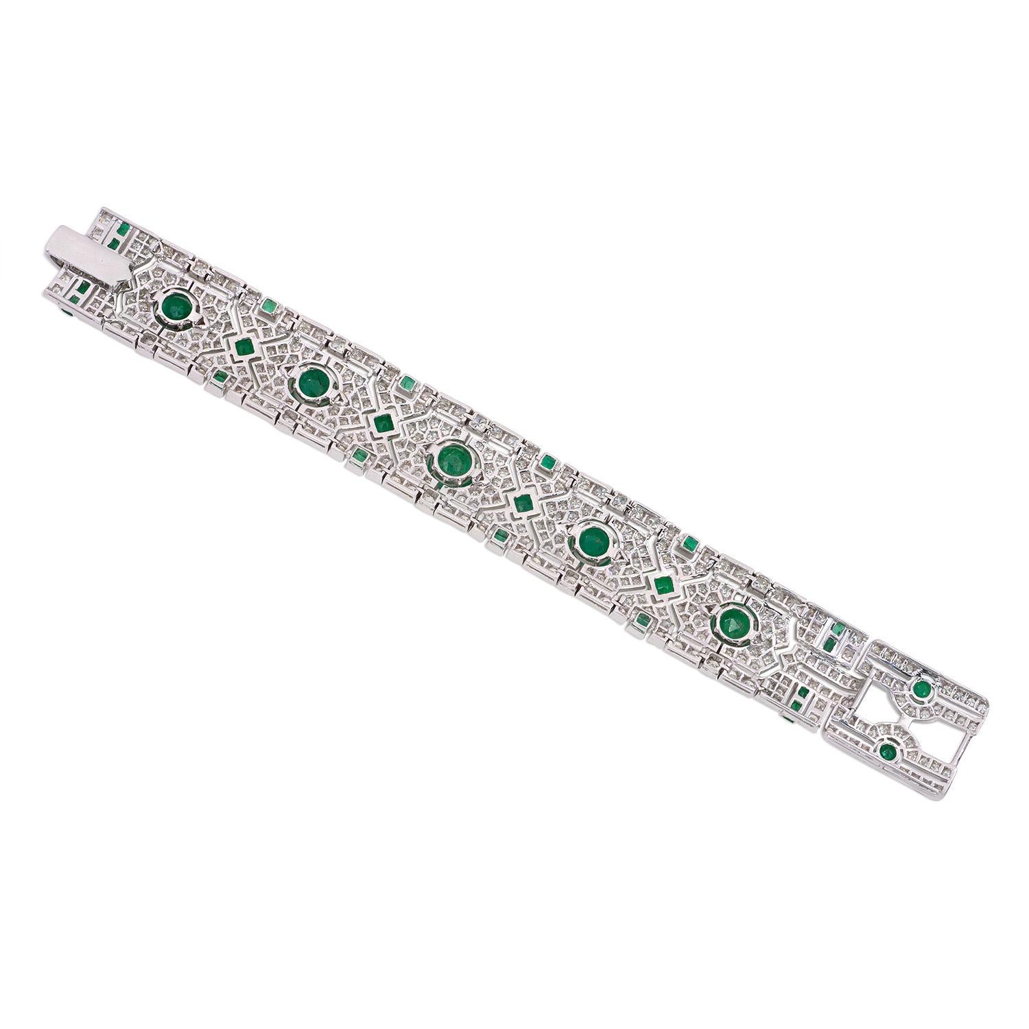 Designed as an openwork geometric strap set with vivid green emerald and diamonds, this art deco style bracelet featuring 13.92 carats of G VS2 round brilliant diamonds and 14 carats of natural emeralds.
Made In 18K Gold


Diamond Details
Round