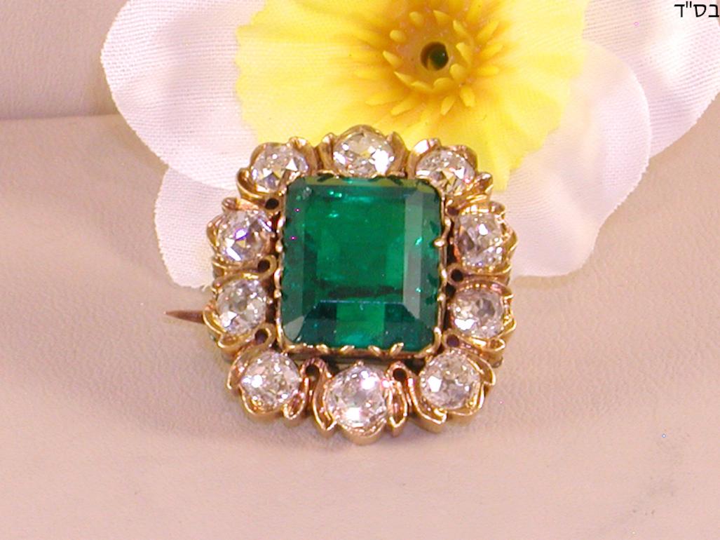 Gold: 14 kt yellow gold 
Weight: 11.05 g 
Emerald: 10.42 ct Transparent green (Fine colour quality) 
Emerald has an IGI certificate number: F5F48375 Feb.23.2010 
Diamonds on brooch: 3.50 ct F-G / VS-SI 
Width: 2.0 cm 
Length: 2.5 cm 
19th century