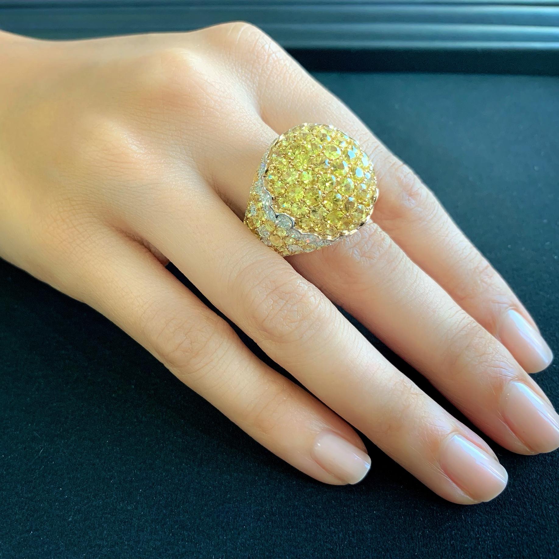 Butani's Dome Cocktail Ring is crafted in 18-karat white gold, and features a cluster of glistening rose-cut and full-cut yellow sapphires and white diamonds.  Wear it as your sole piece of jewelry.  Currently a ring size US 7.  For other sizes,