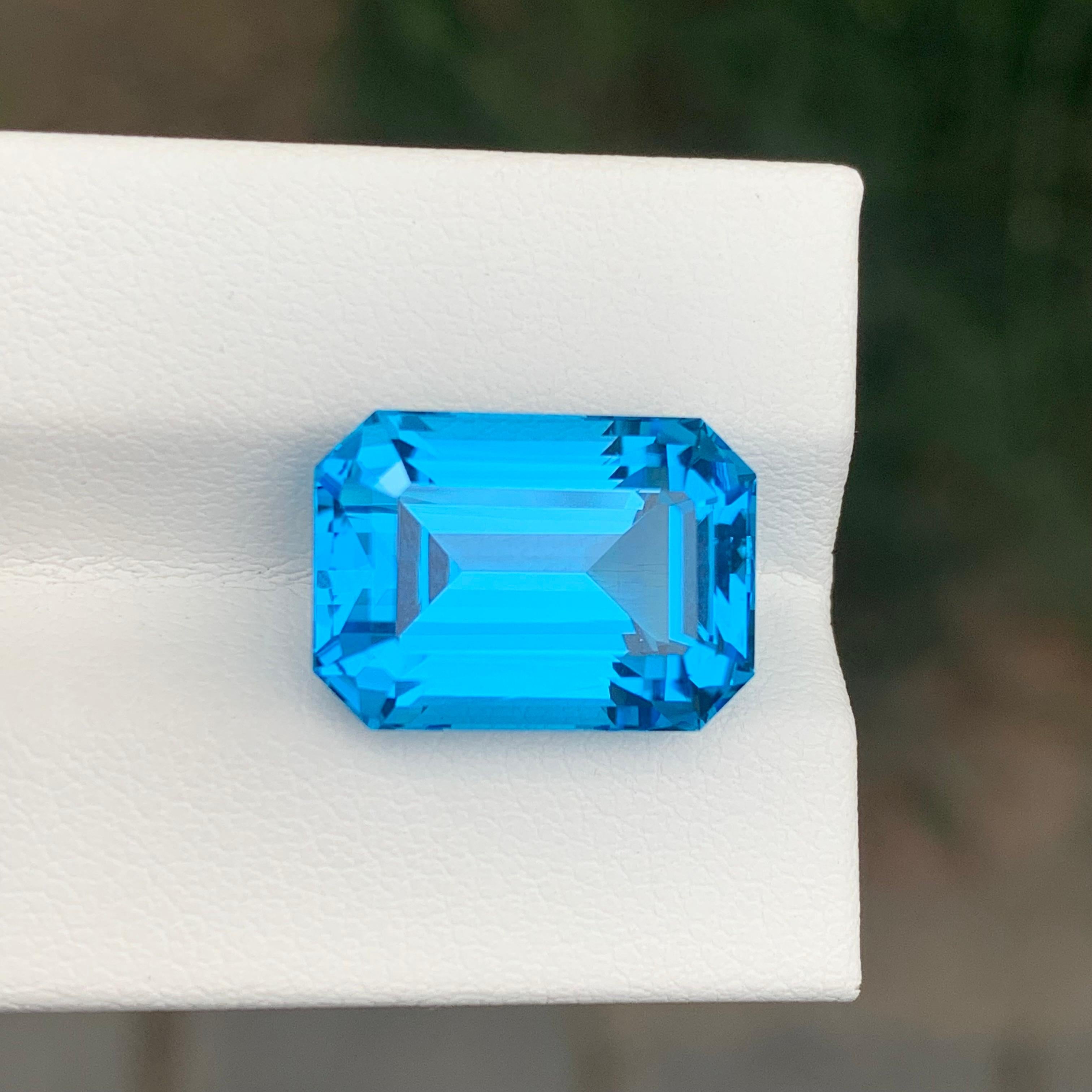 Women's or Men's 13.95 Carat Stunning Loose Swiss Blue Topaz Emerald Shape Gemstone For Sale