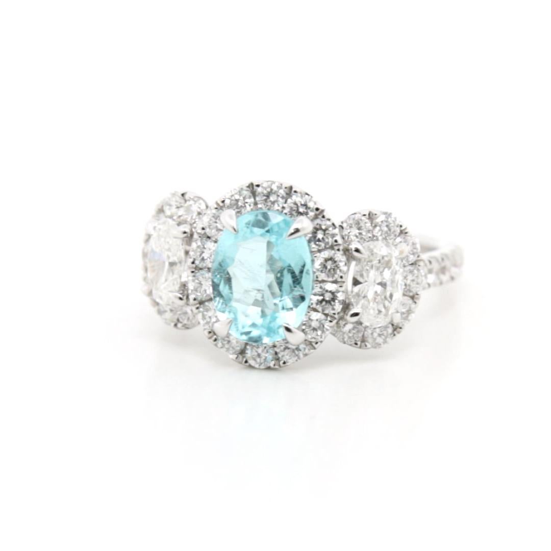 Rare Brilliance: The Brazilian Paraiba Tourmaline Diamond Ring

This exquisite ring is a masterpiece of rarity and splendour, showcasing a breathtaking 1.396-carat Brazilian Paraiba tourmaline at its centre. Known for its vivid, electrifying blue