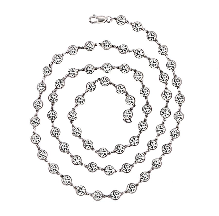 This is a gorgeous platinum by the yard necklace. The necklace is set with sparkling round cut diamonds that weigh approximately 13.96ct. The color of these diamonds is I-J with VS clarity. The necklace measures 4.5mm in width and 21 inches in