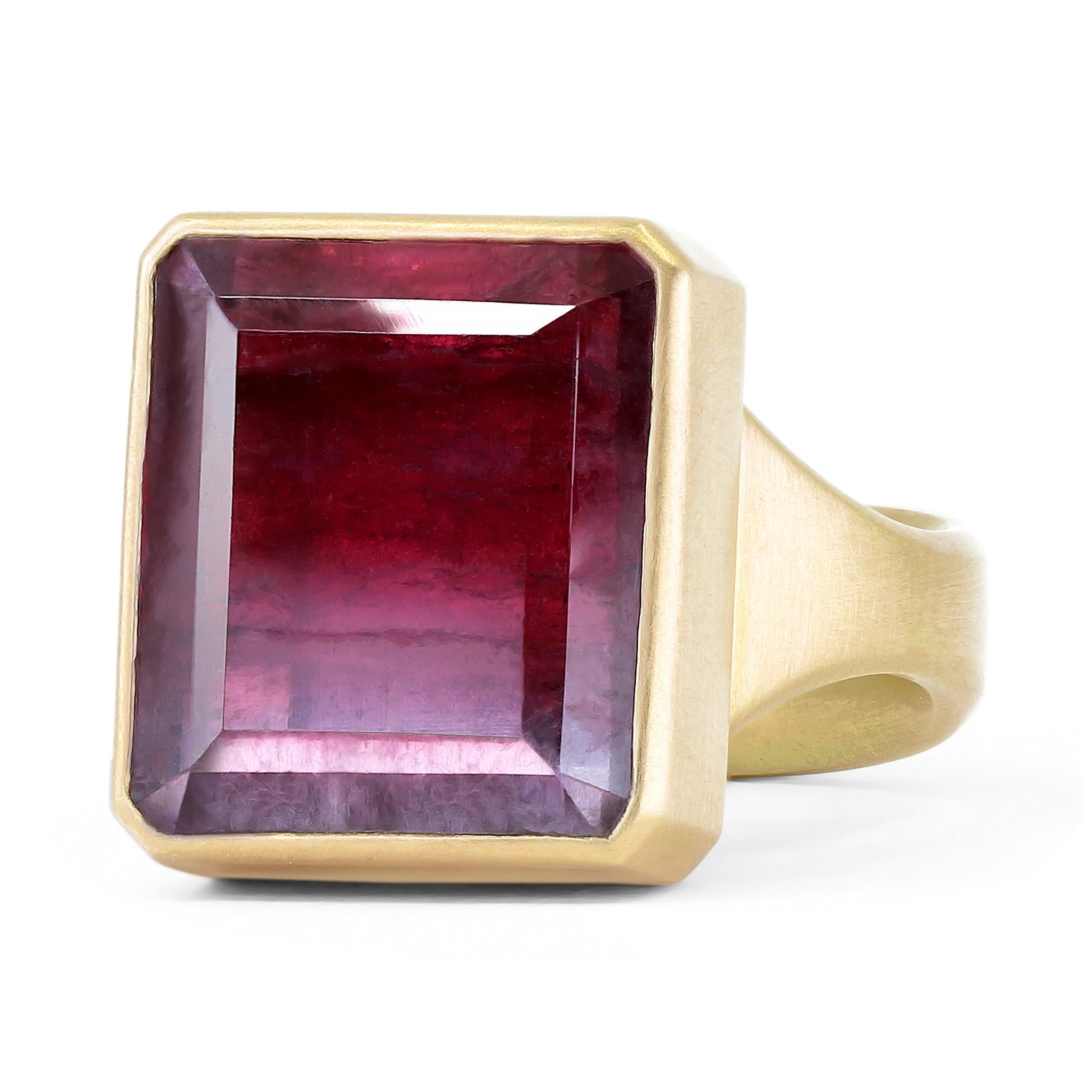 One of a kind ring hand-fabricated by acclaimed jewelry maker Lola Brooks cast in the artist's signature-finished 18k yellow gold showcasing a rare 13.98 carat red and lilac bicolor faceted rectangle tourmaline, an extraordinary natural gemstone.