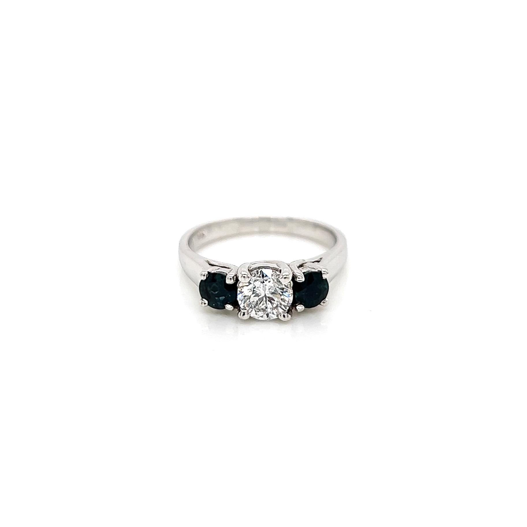 1.39 Total Carat Sapphire Diamond Three Stone Ladies Ring

-Metal Type: 14K White Gold
-0.67Carat Round Blue Sapphire
-0.72Carat Round Natural Center Stone 
-Size 6.25

Made in New York City
