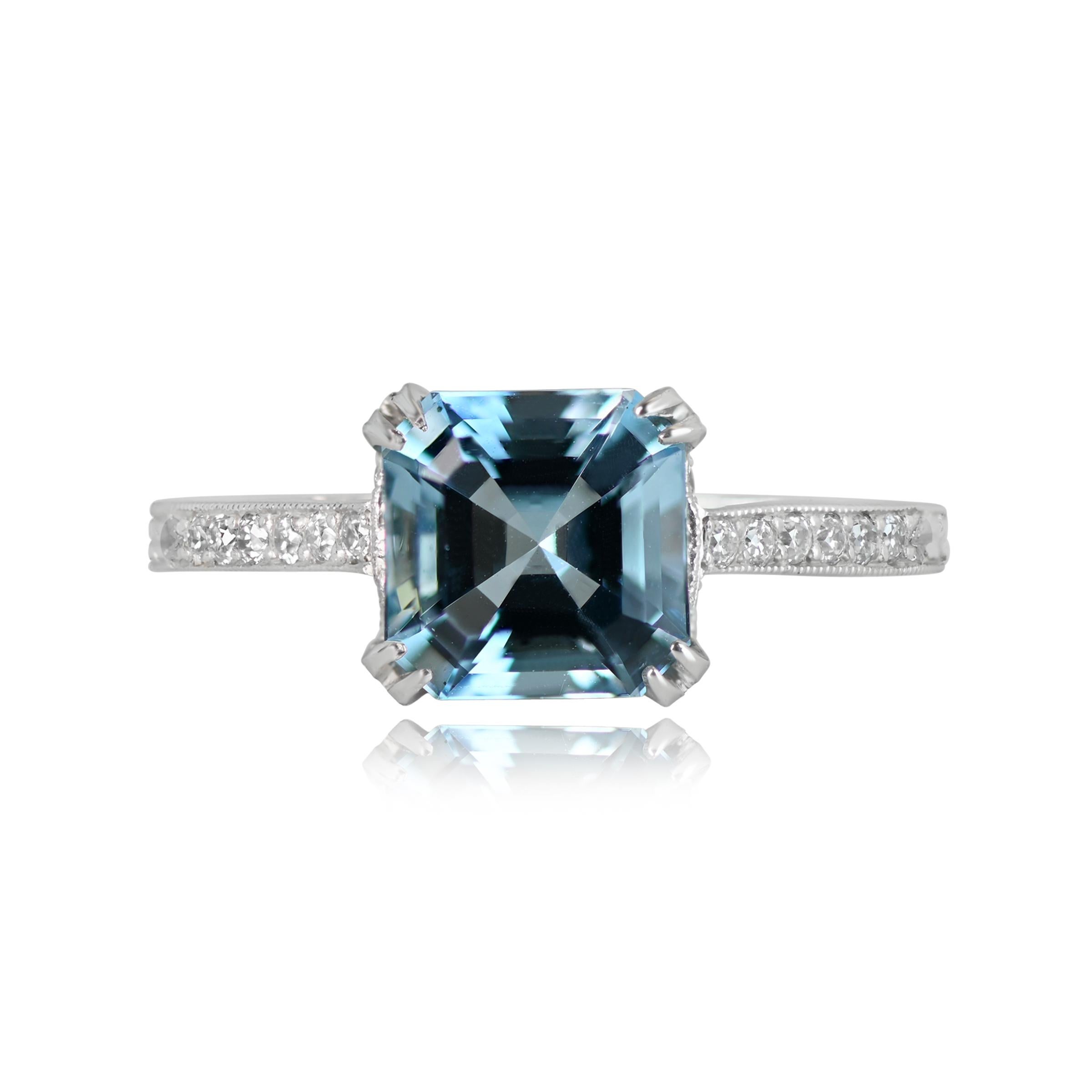 This stunning aquamarine engagement ring showcases a lively 1.39-carat Asscher cut aquamarine in a beautiful platinum and diamond setting. The platinum mounting is adorned with round brilliant cut diamonds along the under-gallery and shoulders,