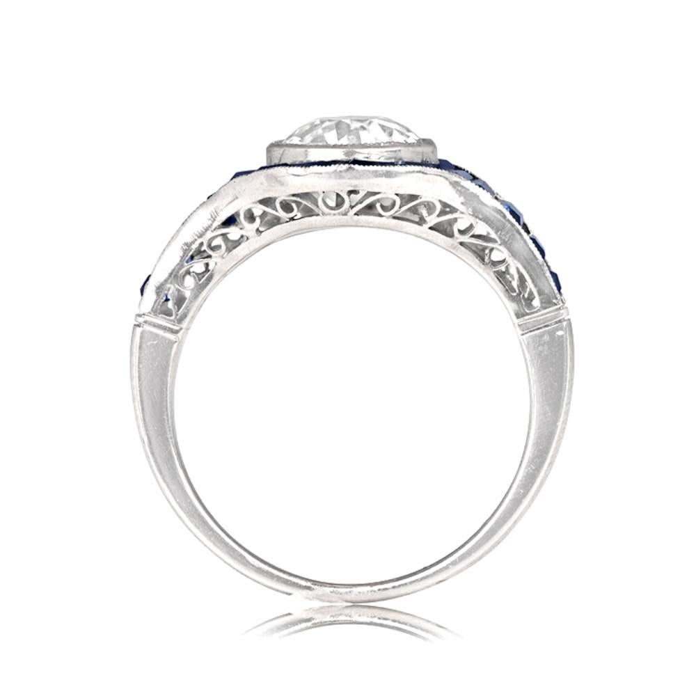 This exquisite ring takes inspiration from the city of Rimini in Italy and exudes the glamour of the Art Deco period. The vintage old European cut diamond at the center weighs approximately 1.39 carats, showcasing a K color and VS2 clarity. The