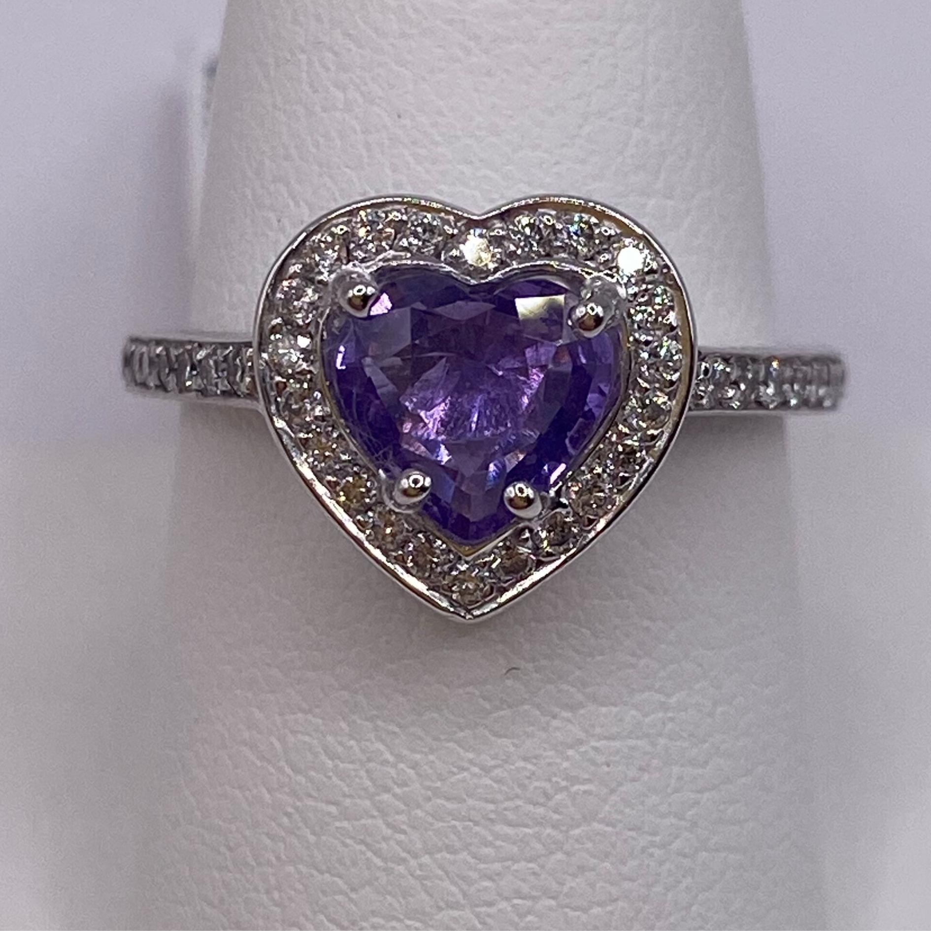 14KT White Gold
Finger Size: 6.5
(Ring is size 6.5, but is sizable upon request)

Number of Heart Shape Sapphires: 1
Carat Weight: 1.06ct
Stone Size: 6.5 x 7.0mm

Number of Round Diamonds: 38
Carat Weight: 0.33ctw

This lovely ring features a sweet