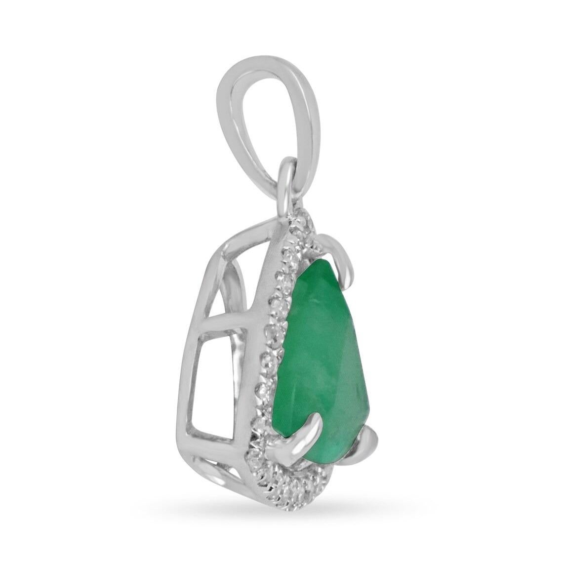 A one-of-a-kind, trillion-cut Colombian emerald & diamond halo solitaire pendant. A large 1.09-carat, earth-mined, trillion Colombian emeralds sits delicately in a diamond prong setting. A rare beauty in every aspect. Gorgeous, green color is evenly