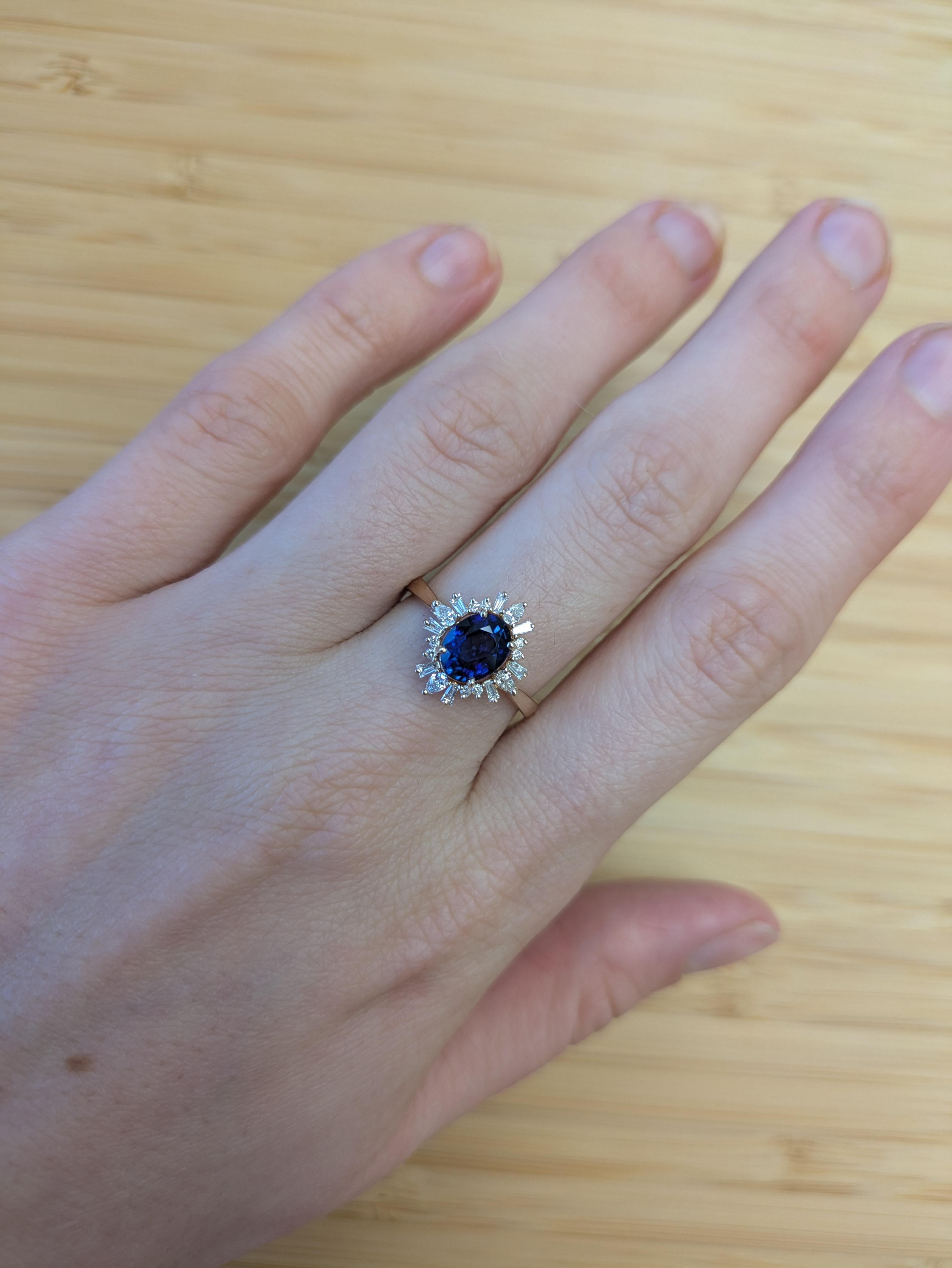 Fit for royalty, this 1.36 carat Ceylon Sapphire is framed in a halo of glittering natural diamonds and set in solid 14K gold. A luxurious statement ring that commands attention with every glance. This ring also makes a beautiful September