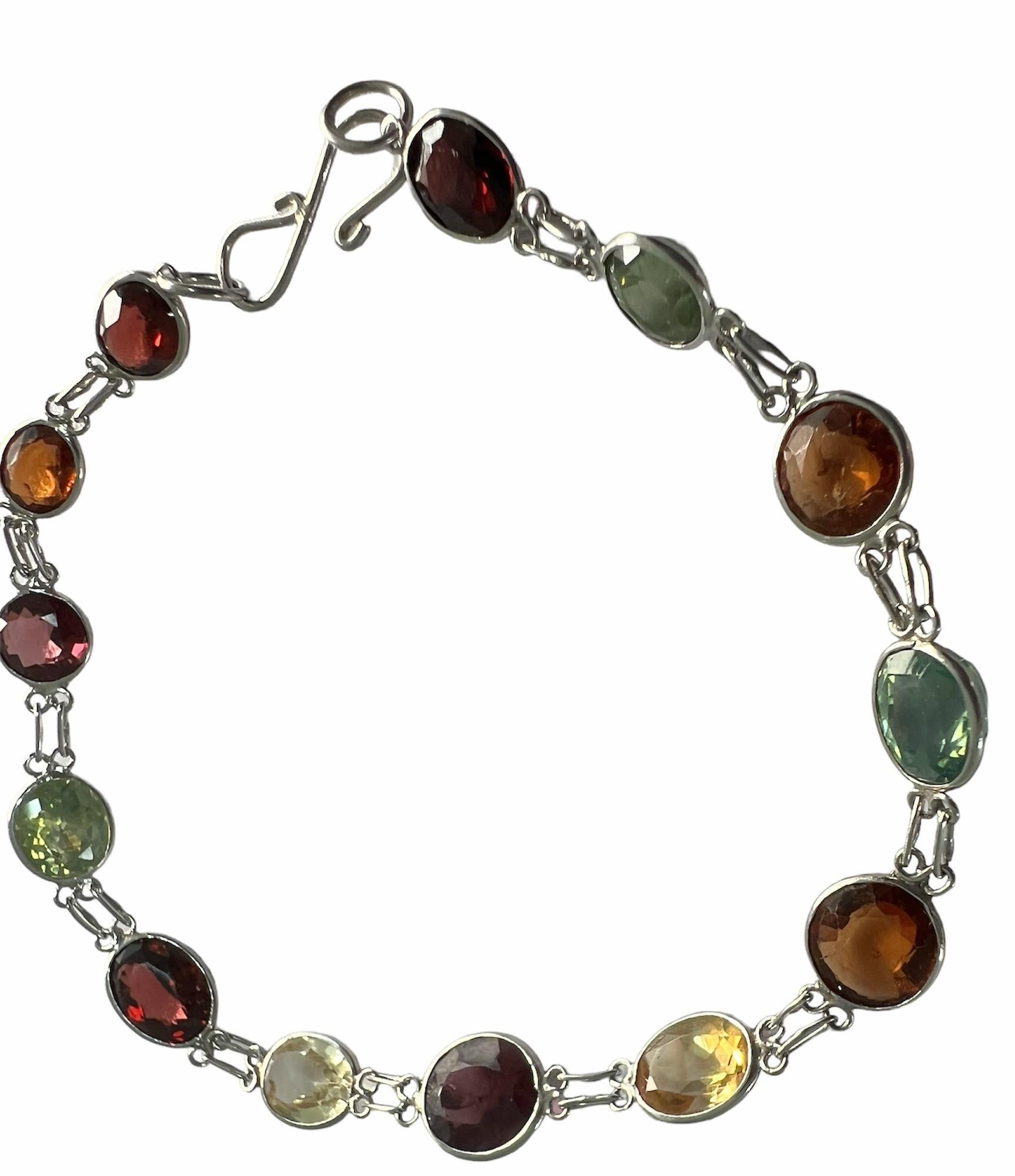 Discover the vibrant tapestry of our Mix Gemstone Link Bracelet, a masterpiece that celebrates the diversity of nature’s artistry. This exquisite bracelet features a harmonious blend of 13 cabochon gemstones, each weighing 1ct, in a radiant array of