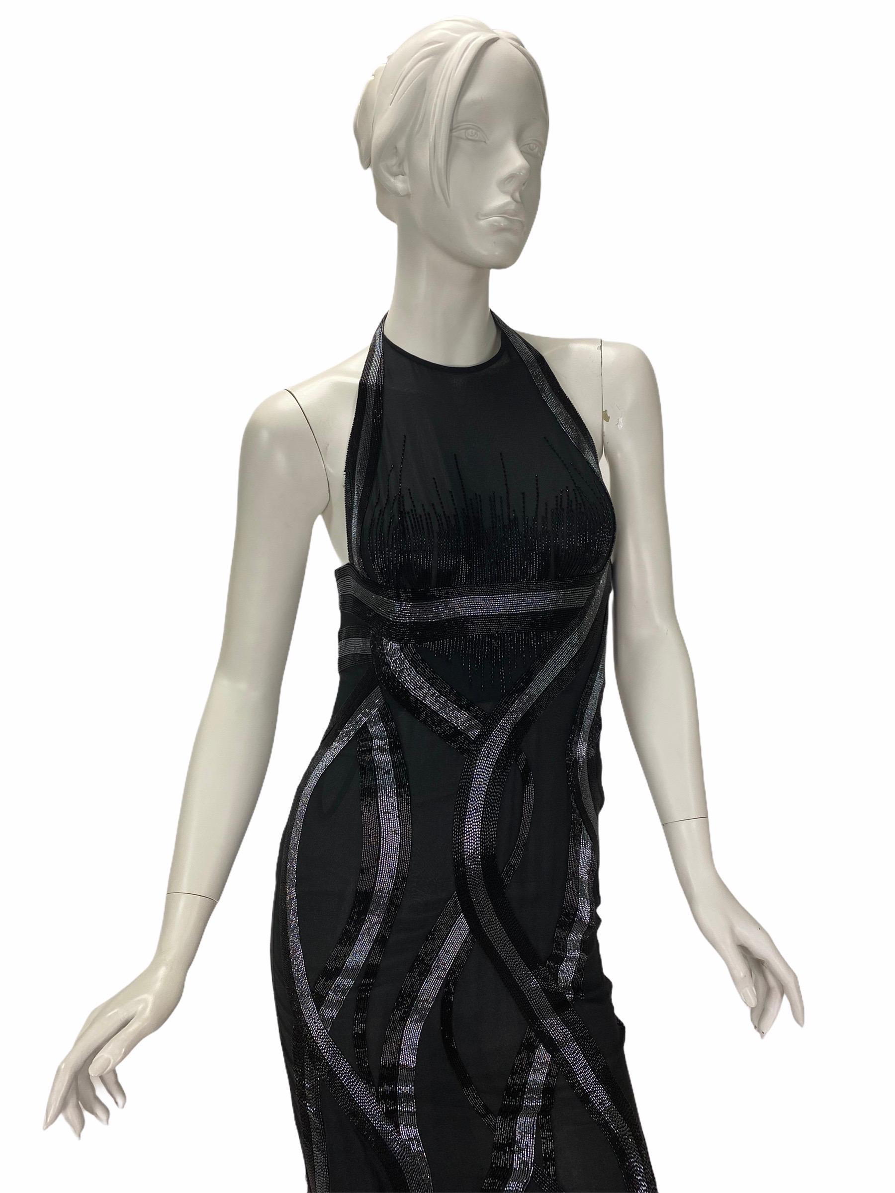 Vintage VERSACE Gown

Black color, mermaid design and artfully embellished body 
with open back - ensure 
a stunning silhouette. 

IT Size 38

Made in Italy

Excellent condition

100% Chiffon Silk

Fully lined

Finished with inner bodice

Retail