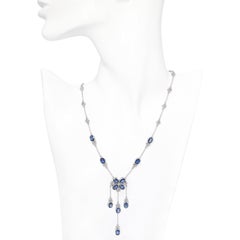 13k White Gold 8.04ctw Sapphire and 1.47ctw Diamond Trefoil Station Necklace