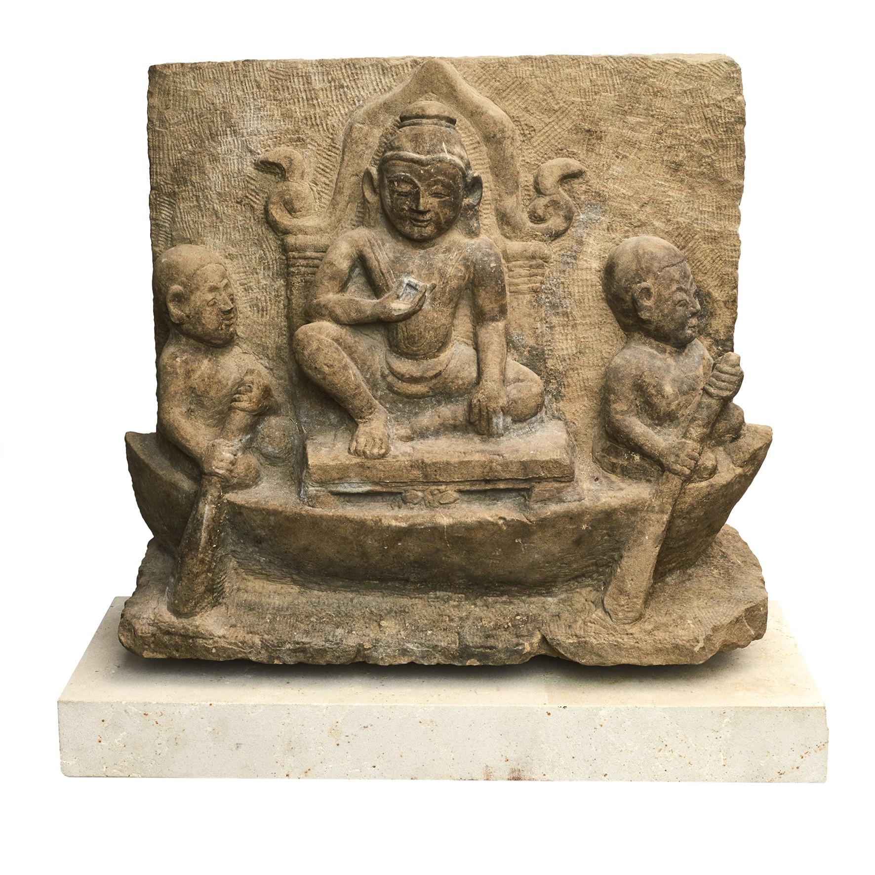 Burmese carved sandstone temple relief depicting Buddha on a throne, sitting in a boat sailed by couple of monks.
From pagoda / temple in Burma (Myanmar), Arakan Province, 1400-1500 century.
In original untouched condition. Mounted on light