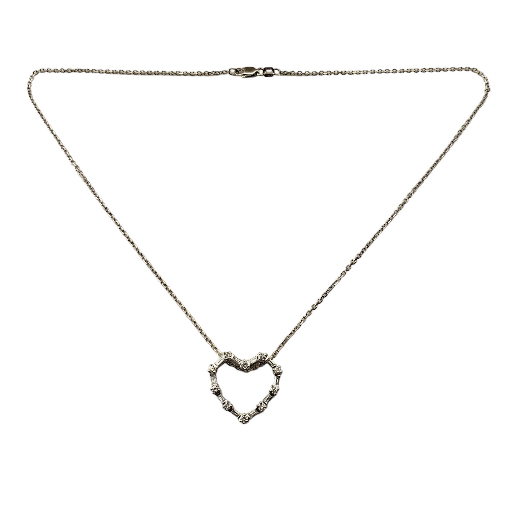 Vintage 14/18 Karat White Gold Diamond Heart Pendant Necklace-

This lovely heart pendant necklace features ten round brilliant cut diamonds and ten baguette cut diamonds set in classic 18K white gold.

*Chain is 14K gold.

Approximate total diamond