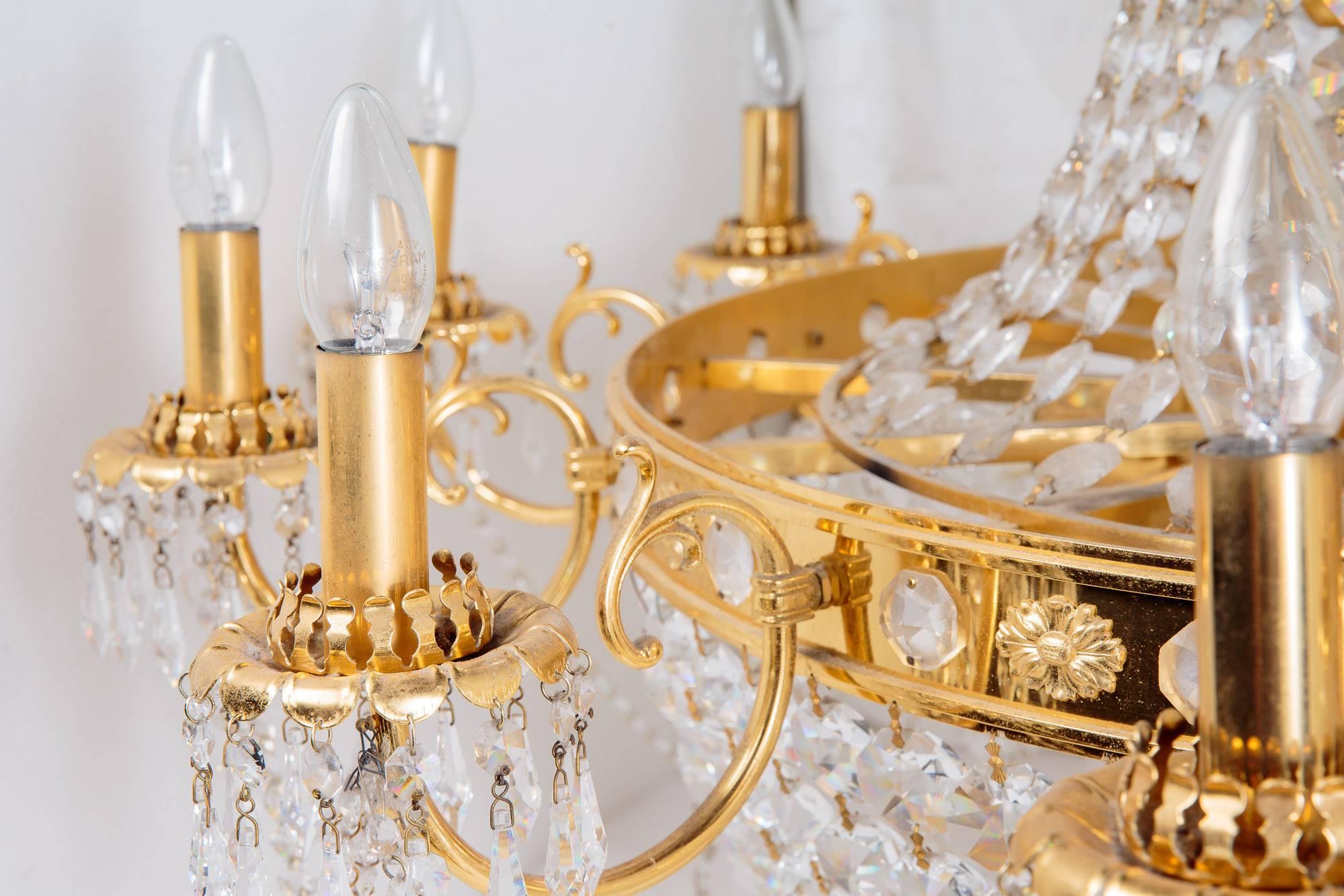 A set of 14 matching cut-glass and gilt bronze chandeliers with engraved storm shades, circa 1960 in the Regency manner. These exceptional chandeliers are all individually export crated. They arrived with us in Dorset, England just last week. We