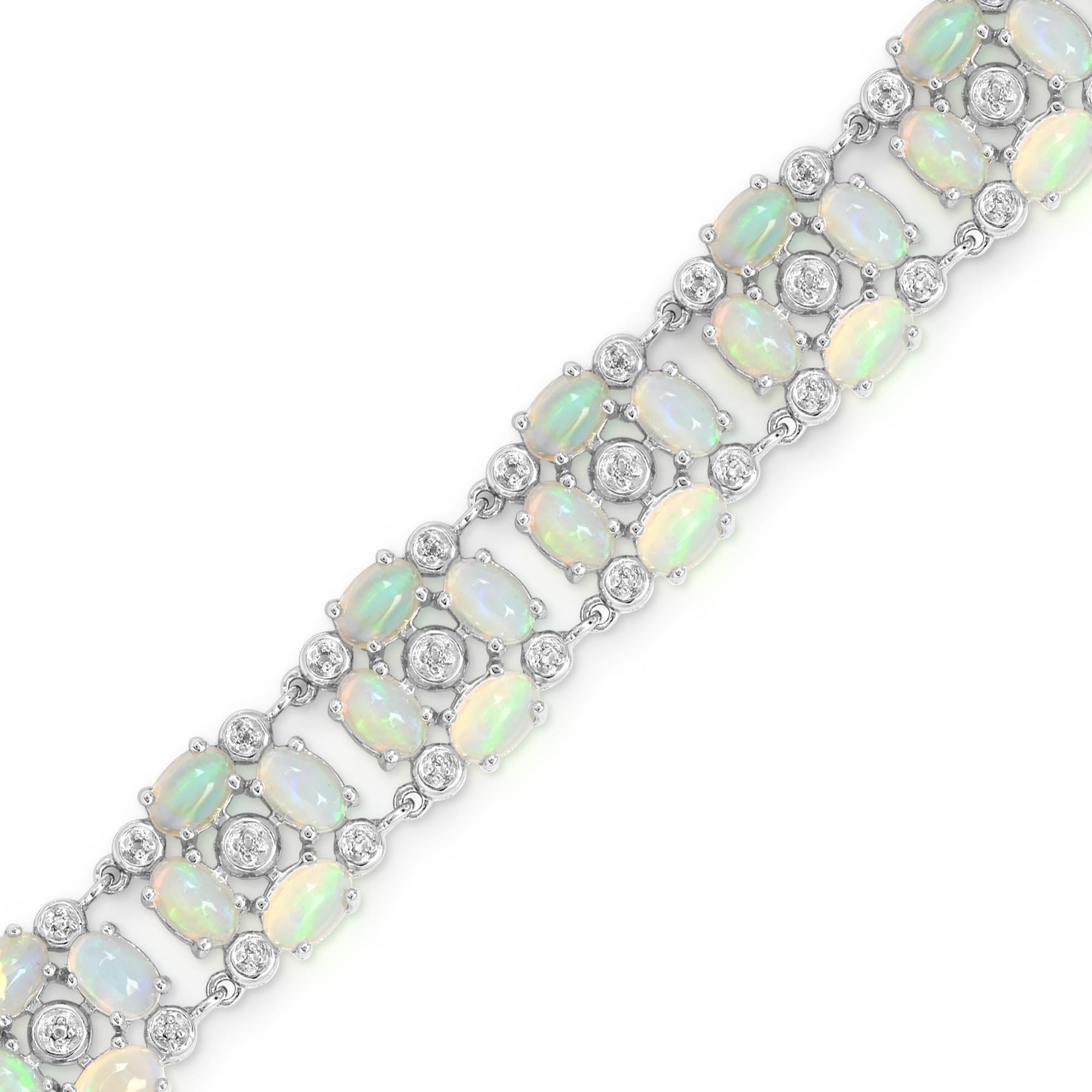 This charming bracelet features 48 stunning oval-cut opal accented by 50 pieces of sparkling round white topaz gemstones, set in a sleek sterling silver design. The hidden open-box closure adds a touch of elegance, making this bracelet both stylish