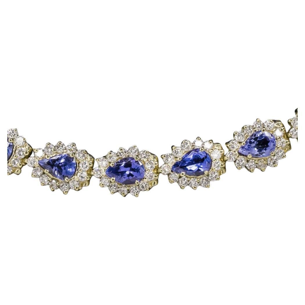 - 14 carats of rich blue pear shape tanzanites

- Bright white and eye clean diamonds

- Diamonds are well cut for fantastic sparkle!

- Satisfying weight at 27.8 grams

- Rich and butter 18k yellow gold setting

- Overall very high