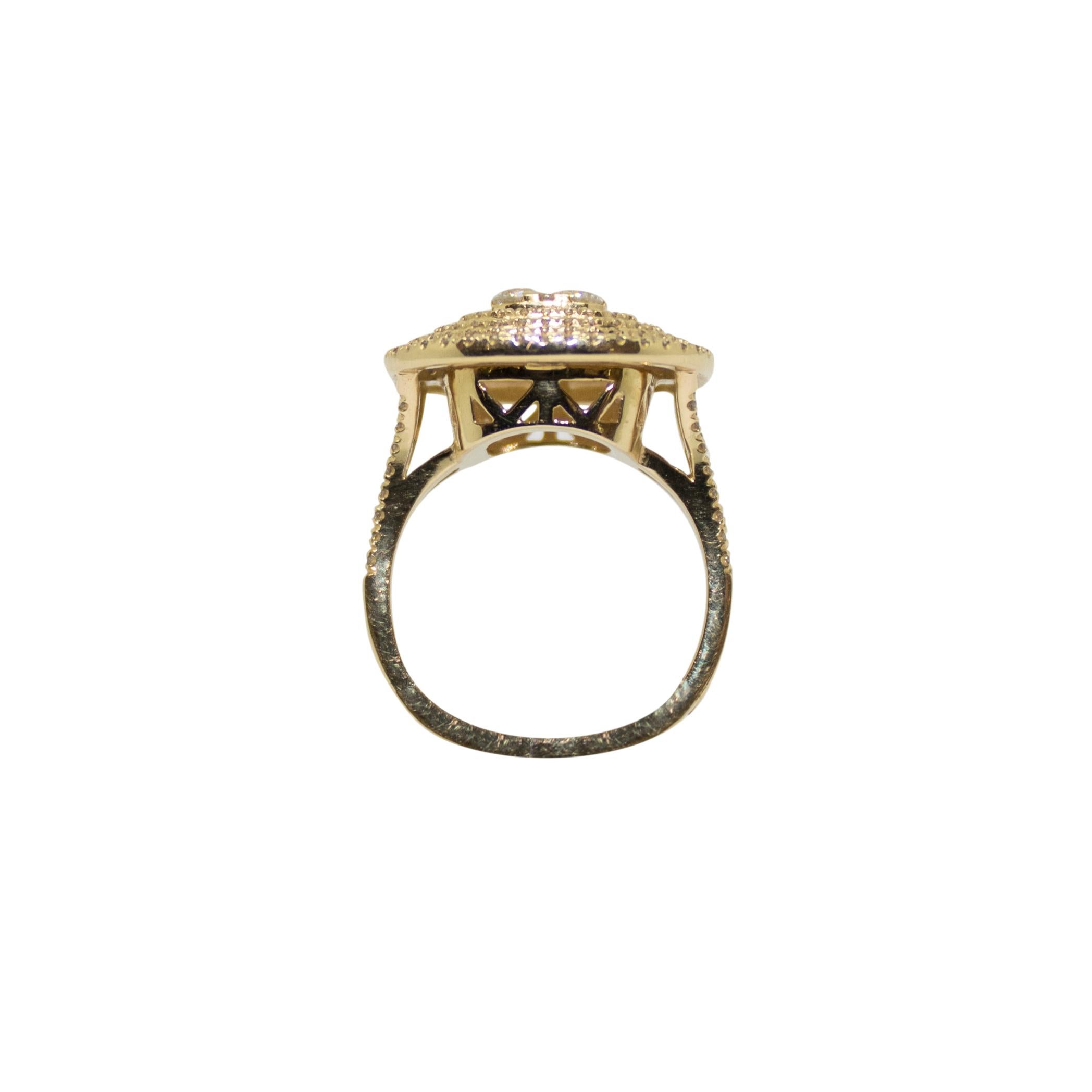 The centre stones comprise a 1.4 carat cluster, surrounded by a triple diamond halo, claw set in 14K yellow gold with split shoulder design containing a half eternity collection of diamond pointers. This bespoke piece can be altered to accommodate
