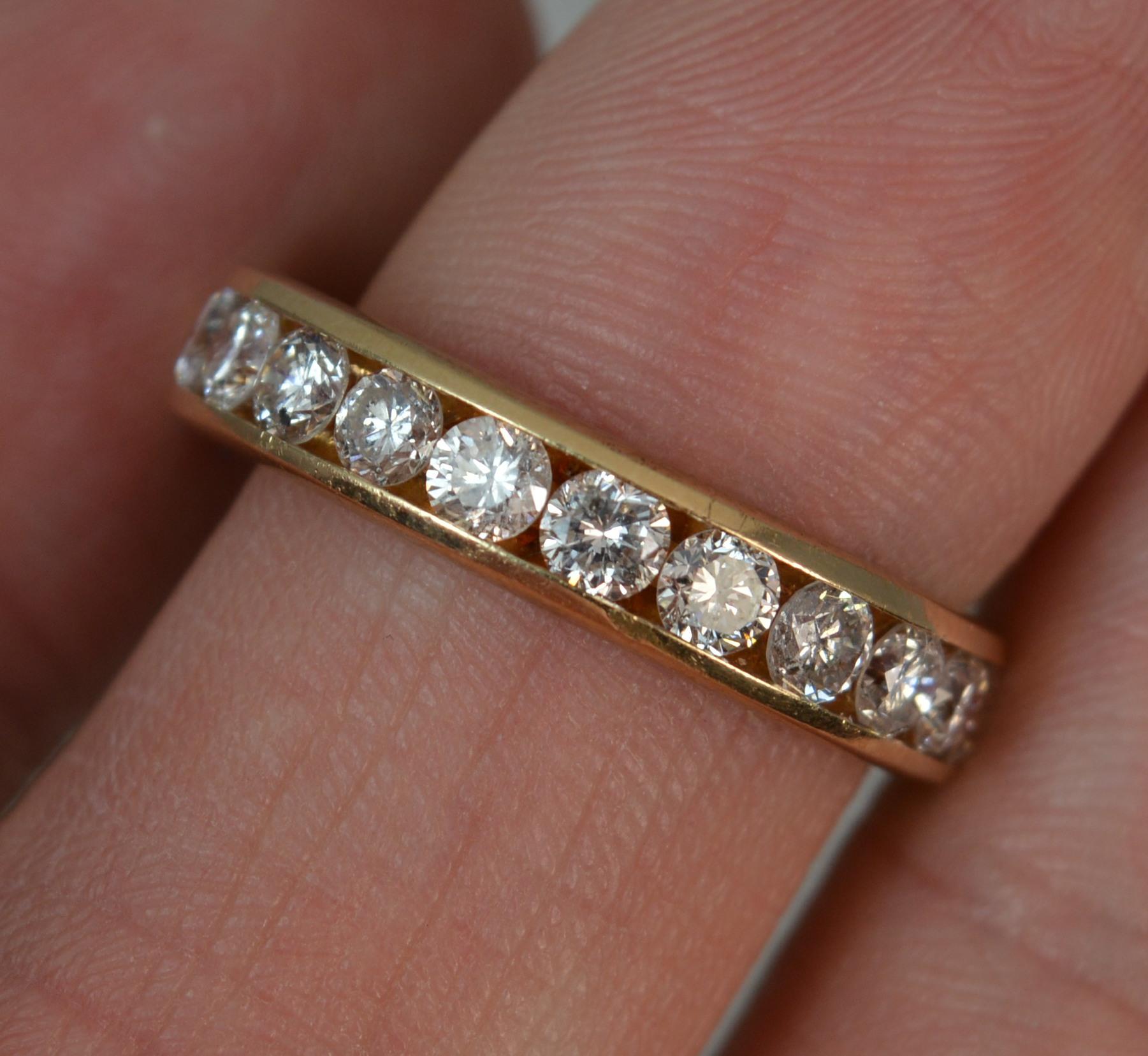 A stunning 14 carat gold and diamond ring.
14 carat yellow gold shank with channel setting.
Designed with eelven natural round brilliant cut diamonds of uniform size, total weight of 1.00 carats. Sparkly example.
21mm spread of stones, 4.2mm wide