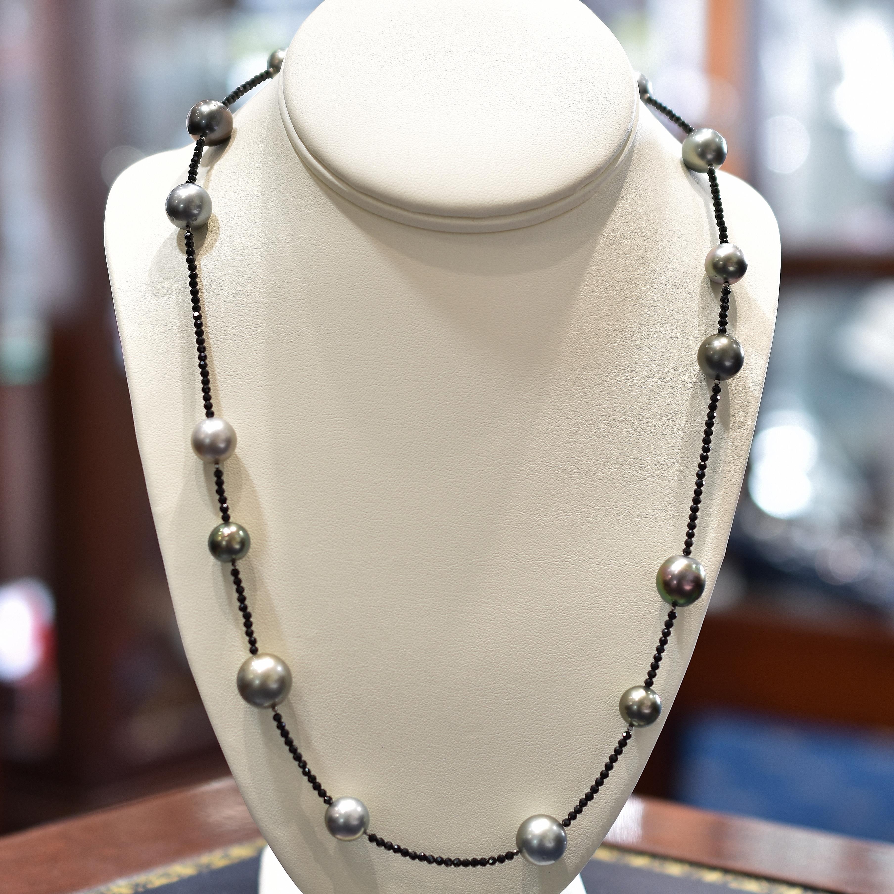 Long strand of multi hued Tahitian pearls and black spinel beads. The strand is 90cm in length. Beads measure 8.3mm to 12.5mm 
