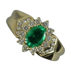 14 Carat Gold Oval Emerald and Diamond Cluster Ring