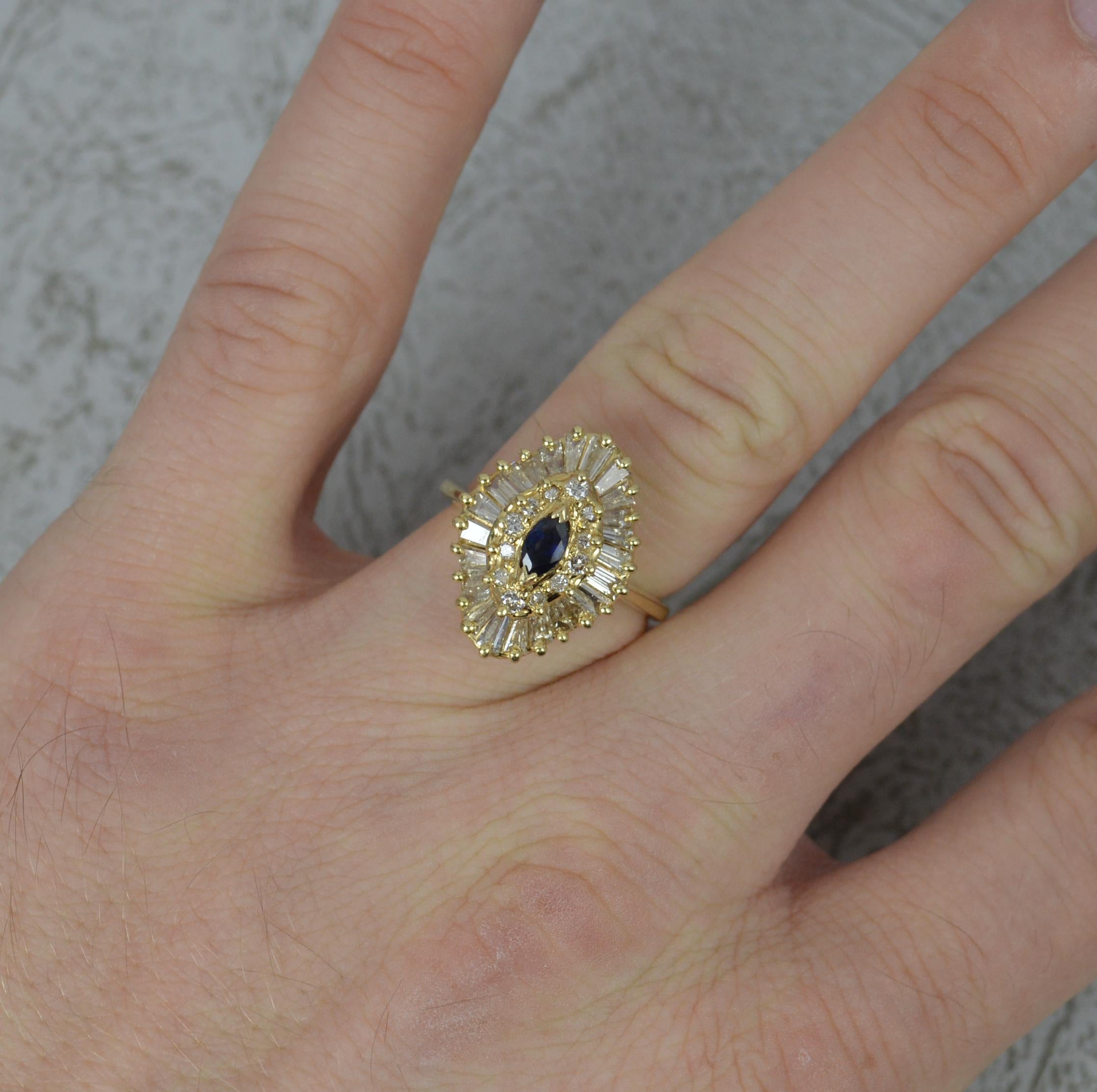 A beautiful Sapphire and Diamond ring in 14 carat gold.
Designed with a marquise shaped blue sapphire to centre with round brilliant cut diamonds and a full border of baguette cut diamonds. Total weight 1.36 carat of diamond as confirmed to