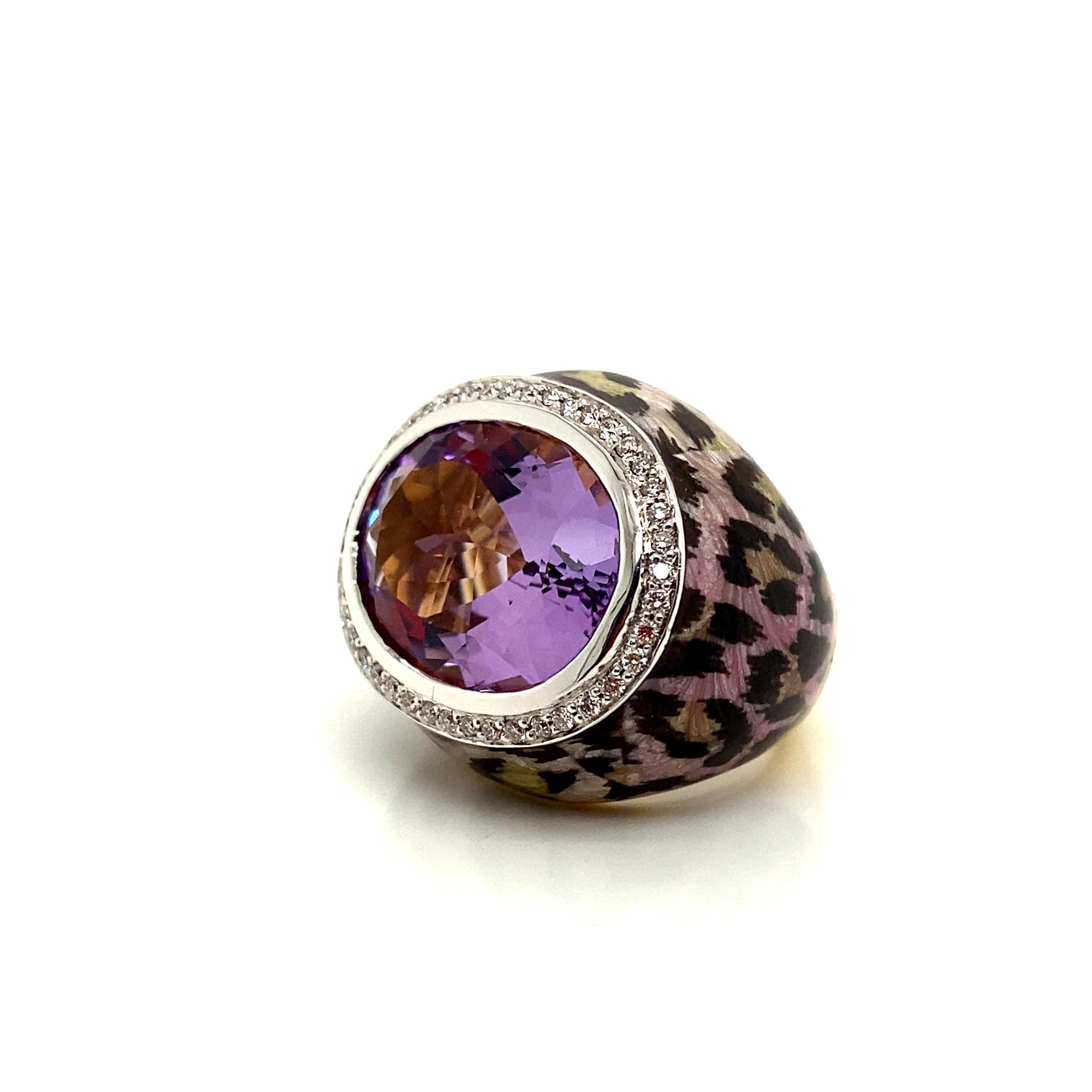 14 Carat Natural Oval-Cut Amethyst and White Diamond Yellow Gold Cocktail Ring:

A unique ring, it features a natural oval-cut amethyst bezel set in the centre weighing 14 carat surrounded by a halo of white round brilliant-cut diamonds weighing