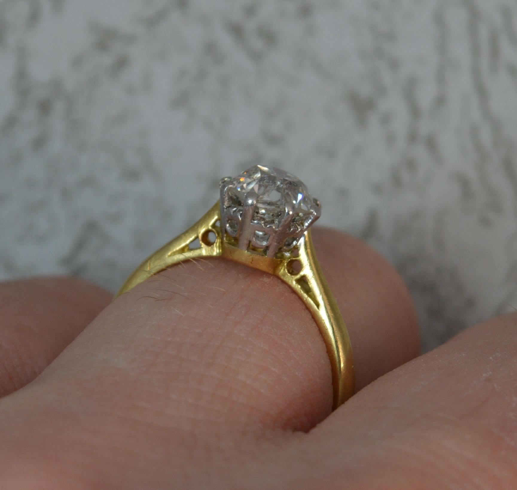 A true antique diamond solitaire engagement ring.
Solid 18 carat yellow gold shank with platinum head and claws.
Designed with one single natural old European cut diamond in eight claw setting. Measures approx 6.8mm diameter, approx 1.4 carats,