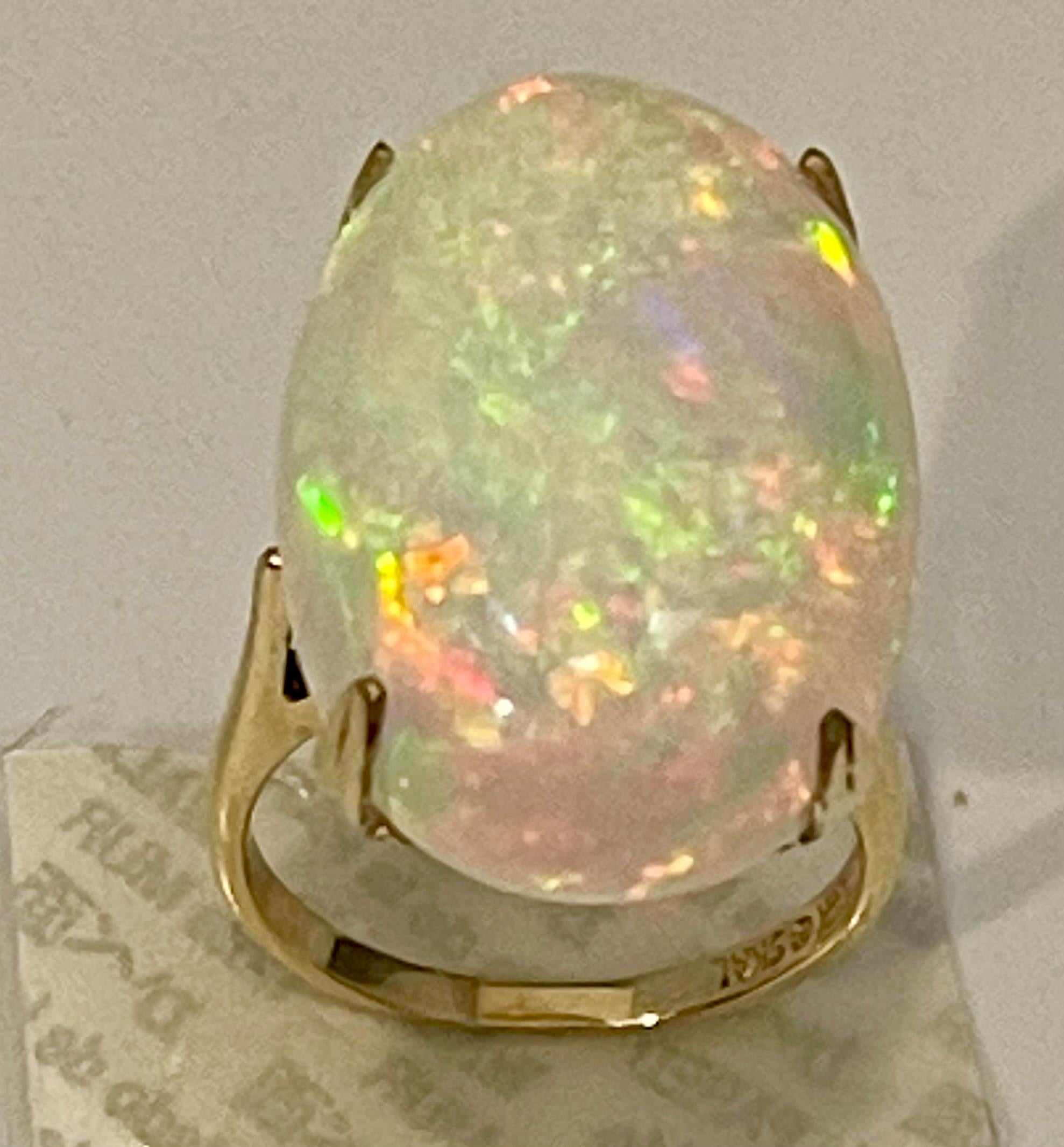 14 Carat Oval Shape Ethiopian Opal Cocktail Ring 14 Karat Yellow Gold In Excellent Condition For Sale In New York, NY